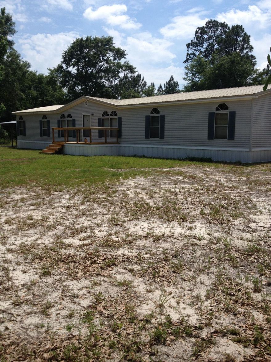 Quiet country manufactured home that backs up to 1000 acre conservation land tract. 1.3 acres with spacious home. Extra large master suite. Great kitchen with lots of cabinets. Fireplace in living room. Less than 10 minutes east of Freeport, 20 minutes to International Airport and 25 minutes to the beach.