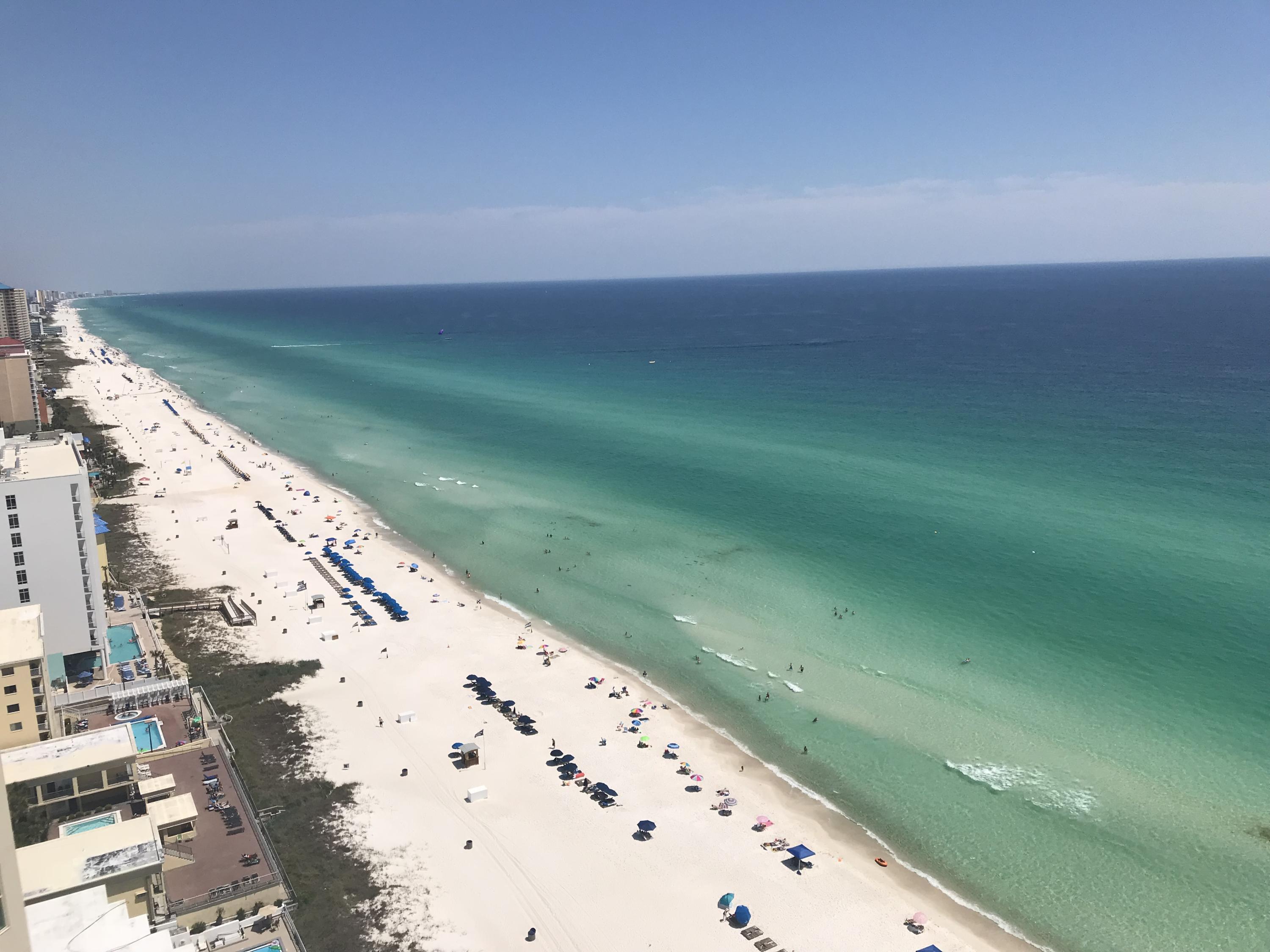 Majestic and meticulously detailed, this professionally decorated coastal chic penthouse residence is located in the Aqua Resort. With its ideal location within walking distance to Pier Park, Aqua has unrivaled amenities including but not limited to poolside cafe, aromatherapy steam room and covered parking for your convenience. Elevators are conveniently located and said to be some of the fastest on the beach. Upgrades include stainless steel appliances in the kitchen, new washer/dryer, granite countertops and 11' ceilings. This condo features floor to ceiling windows overlooking the emerald coast on the Gulf of Mexico. Enjoy the sound of the waves from the expansive terrace with Plexiglas allowing for unobstructed views. The spacious layout places the master and guest rooms at either