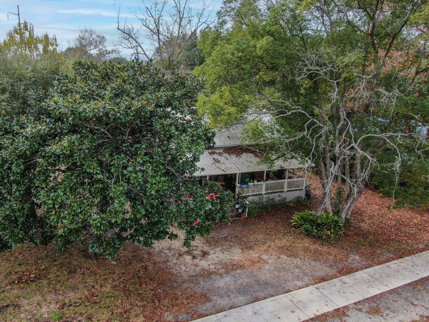 If you like unconventional and quirky historic homes, you definitely have to check out this cute clapboard style 1930 home in downtown DeFuniak Springs! Positioned on 2 city lots, this fixer upper has wide covered cypress porches in front and back. The kitchen and living room are open and more like a great room than separate spaces. Coupled with 9' tall ceilings, it makes it feel very spacious. Authentic tongue and groove ceilings and walls add that special touch. Two bedrooms plus a current 3rd bedroom on the converted back porch. There are two baths; one unfinished. So much potential with this one! Restore it - or start fresh with new construction on 1 or both lots. Cash only. Own a piece of DeFuniak Springs history, a short drive or walk to downtown and all that the city has to offer.