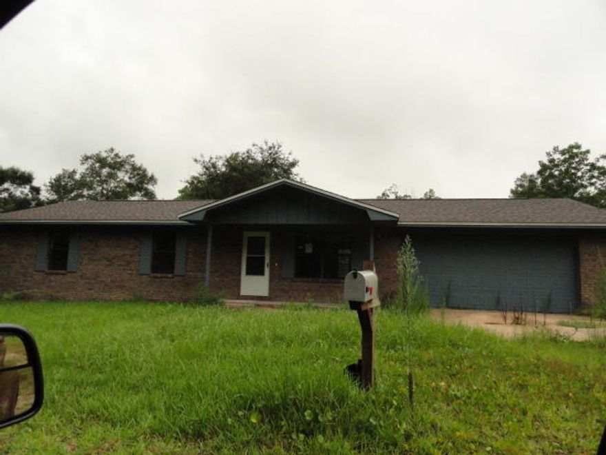 Situated in the middle of Defuniak Springs 6.64 acres with 3/2/2 all brick ranch home. The property backs up to commercial property. The home received a complete renovation. New roof, appliances, flooring, fresh paint, and finished out the garage. Country living with City amenities. Buyer must verify zoning and future land use with the city of Defuniak Springs. See attachment for PAS requirements and WFHM offer submittal information in MLS document section.