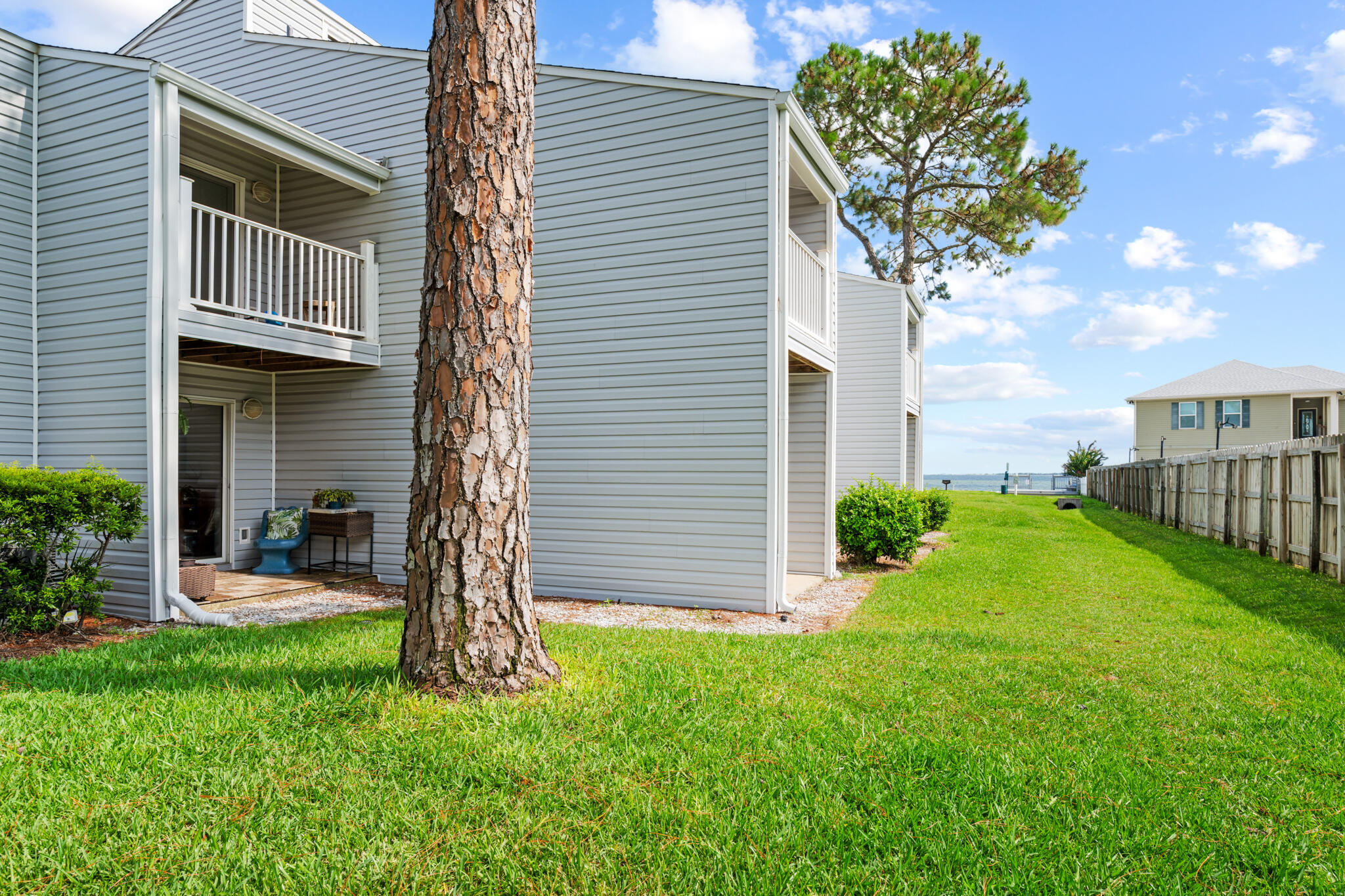 Located in the quiet, gated waterfront community of Finisterra, this 2-bedroom, 1-bath condo offers comfort, convenience, and a serene coastal lifestyle. The unit is just steps from the water and has been thoughtfully maintained, with the HVAC system, water heater, and refrigerator all replaced three years ago. The roof was replaced in 2022, providing peace of mind for years to come. The seller has also added AlumiConn connectors throughout the unit to meet current insurance requirements. Finisterra is surrounded by water, with Choctawhatchee Bay to the south and Lake Como to the east, offering beautiful views and a relaxing environment. For boating enthusiasts, Two Georges Marina is located directly across the street, making it easy to enjoy life on the water.