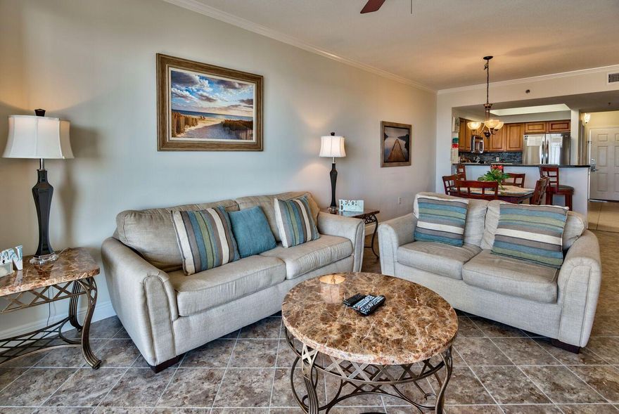 The most amazing southwest coastline views for miles! Beautifully renovated will all tile, custom features and not a thing left to do but bring your toothbrush and tooth paste. Very tastefully decorated and owners are passionate about the beach and the area...IT SHOWS! The artwork is stunning. The sunset views from this unit are truly unbelievable and must be seen to appreciate. Nice quiet balcony with privacy. Ariel Dunes II boasts two large pools totaling approximately 12,000 square feet as well as convenient deeded access to over 2,000 feet of white sugar sand beach. Shopping, restaurants all within walking distance.Selling furnished with the exception of two personal photos on the wall in the living room (you will understand when you see them), the Pack-N-Play, high chair and the lock