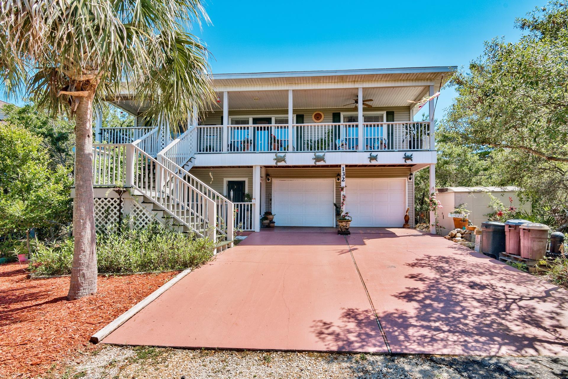 Priced to SELL. Incredible opportunity. This cottage will not disappoint ! Tucked one block north of 30A and walking distance to THREE beach accesses this is the ideal spot. Enjoy entertaining in the open living & practically brand new kitchen with stainless steel appliances & Silestone counters. There is easy to maintain wood laminate flooring throughout & tile in kitchen and baths. The large yard offers a gathering destination with native landscaping and privacy from neighbors. Ample space to spread out.install a poolroom for boat, cart or RV storage. A workspace nook in the super clean TWO CAR GARAGE is a rare find this close to the beach! Listen to the Gulf waves crash ashore in over 500 SF of porches.
