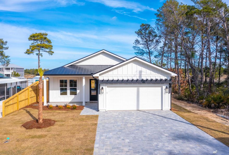 *MOTIVATED SELLER* Beautiful New Construction home featuring 1603 square feet heated/cooled PLUS an ADDITIONAL 400+ sq ft of living space with the 2-car garage (that is fully insulated, heated, cooled, and includes large window) that could be used as a fourth bedroom or game room.  A charming beach bungalow where modern design meets coastal luxury. Perfect for your primary/second home; or SHORT-TERM RENTALS are allowed. Nestled on the quiet west end of Panama City Beach and a very short distance to 30A. South of Hwy 98 and a short walk to the beach access! When not at the beach, kick back and enjoy the beautiful backyard which features a PRIVATE INGROUND SALTWATER POOL with brick pavers, 8-foot privacy fence, outdoor shower, and plenty of space for FUN! From palm trees, professional landscaping, covered porches (with upgrade of natural wood tongue & groove ceilings), unique exterior fa??ade using multiple materials, brick paver driveway, garage door pergola, all the way down to the display of the house numbers creates a CHARMING CURB APPEAL. Inside, the light tone of the Luxury Vinyl Plank flooring combined with the bonus of 10 ft ceilings and 8 ft doors offers a spacious flow. Little accent touches of beautiful blue hues give it a perfect beach vibe every day. The GOURMET KITCHEN is the center of attention with white cabinets (self-close hinges), upper & lower cabinet lighting, ceramic tile, quartz countertops, starring a beautiful island with custom millwork accents, high end lighting, stainless steel appliances, and a stunning wet bar with sink, beverage refrigerator, and floating glass shelves. CUSTOM MILLWORK also includes bedroom accent walls, living room slat wall feature, window & door trim, wood closet storage systems, and laundry/mudroom hall tree with open storage. LUXURY BATHROOMS with floor to ceiling tile, zero entry shower with frameless glass door, deep soaker tub, freestanding vanities with 5 ft tall mirrors, all trimmed out with gold fixtures. Focused on quality & custom details, plus lots of little extras to make this home special. City Water & SEWER, energy efficient spray foam insulation and so much more. Annual Rental projections of over $84,000 in the documents. COME CHECK THIS HOME OUT, IT IS A MUST SEE! Buyer to verify all measurements if deemed important.