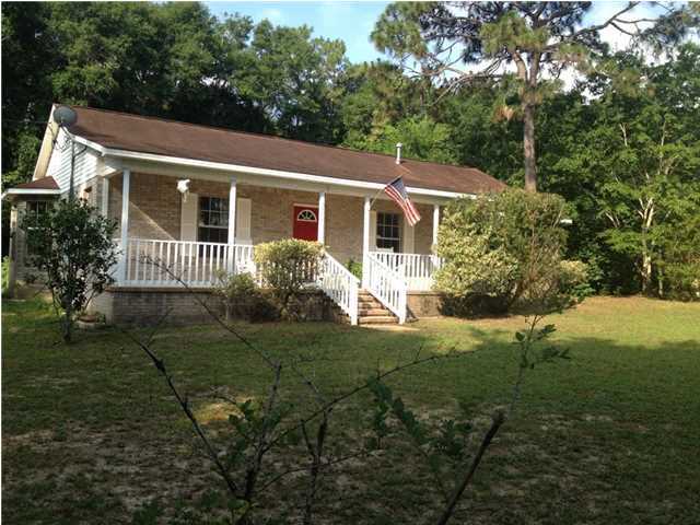 Available 02/05/2014...........Cute as a button! Country living with easy commute to Eglin,7SFG, beaches and shopping. Almost one acre this home has space for the garden, cars, boat and the family. Ranch style home features large front porch, 3 bedrooms 2 bath, laundry room, wood burning fireplace and much more. Large eat in kitchen with plenty of cabinets and counter space with bar. The 3rd bedroom with fireplace that is adjacent to the kitchen can also be used as a large family room/den. Screened porch overlooks patio and private wooded yard. Master bedroom has built in shelving for books, audio system, or just collectibles. Neutral paint and easy care flooring. No inside smoking. Pets may be allowed with a $400 non-refundable pet fee. This really is great country living.