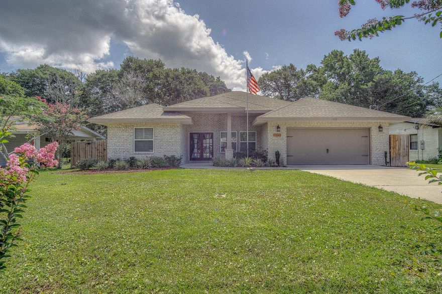 HUGE FWB LOT with a 2015 Award winning builders plan. Welcome home to this LARGE, 4 bedroom,and 2 HUGE bathrooms! 10 FT ceilings and crown molding flow through out the home. In all of your main living areas you have a beautiful wood like tile plank that is EXTREMLY LOW maintenance and cozy carpet flows into the bedrooms. When you first enter the home you have a welcoming dining and Then you enter the main living area. The kitchen and living room boast an amazing open floor plan. The kitchen has beautiful granite countertops, stainless steel appliances including a commercial grade fridge, TWO pantrys. The oversized master has TWO walk in closets. The on suite bathroom is a MUST see. Its space with a separate shower door, garden tub, and double vanities. Screened in covered porch with a T.V.