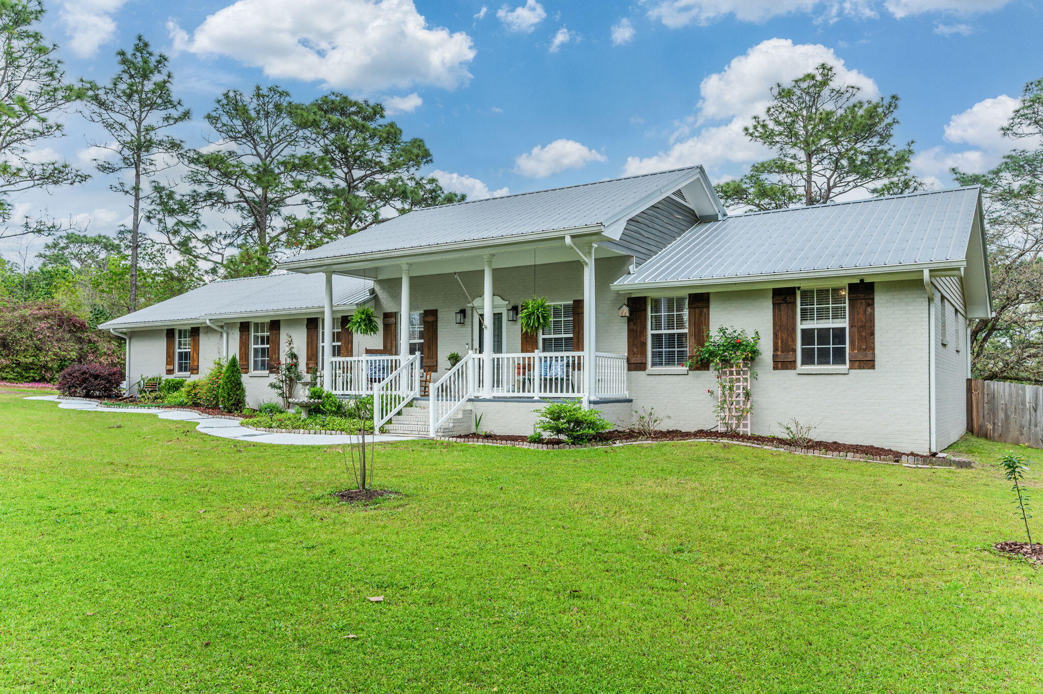 Beautifully remodeled 3BR/2.5BA home on 1.5+ acres in Ten Lake Estates! Features new flooring throughout (2022) and a cozy wood-burning fireplace in the dining room. The kitchen includes solid surface countertops, newer appliances, and a large pantry/utility area with new half bath. The master suite offers a private office/bonus space--great for a nursery, workspace, or quiet retreat. Nearly every room provides peaceful views of the natural surroundings. Outside, enjoy an established garden, space to add a pool, and a detached man cave/she shed perfect for hobbies or relaxation. Major updates include a new roof (2019), new septic tank and drain field (2024), new PEX plumbing (2024), and two new water heaters (2024/2025). Move-in ready and full of charm!