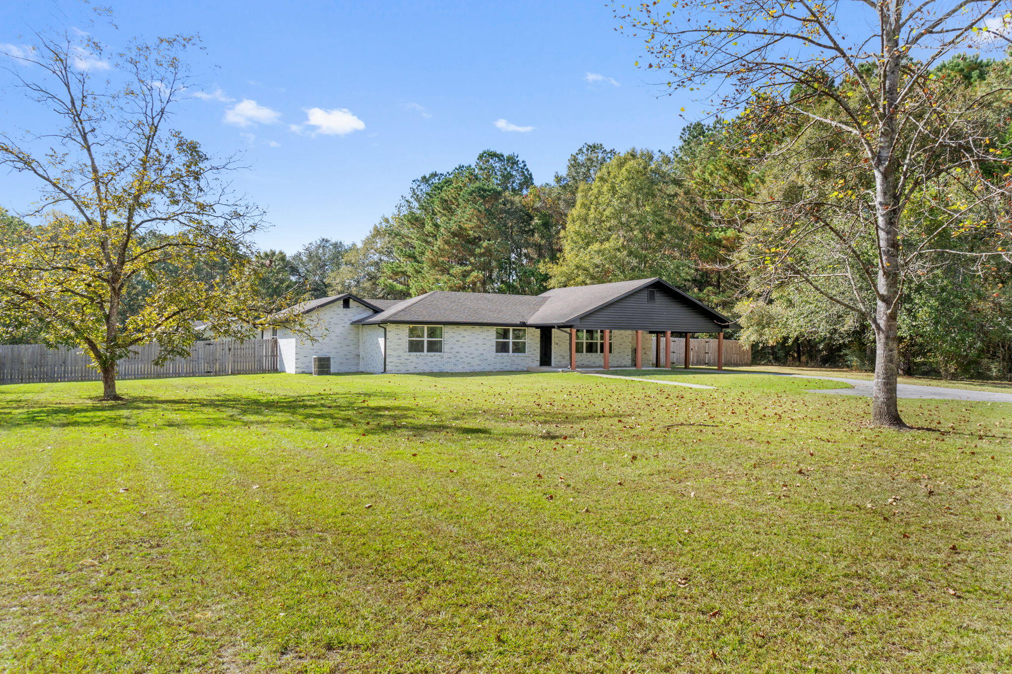 Welcome to 4962 Antioch Road in Crestview--a spacious, beautifully updated property on a picturesque corner lot of just over an acre. With a VA assumable loan option at an incredible 2.9% interest rate, this home offers significant savings.Situated south of Highway 90 and directly across from Blackwater Golf Club, this property combines convenience with tranquility. Being on county land, not city, means lower taxes, and the property's lush landscape includes 2 pear trees, a pecan tree, and a walnut tree.This 2000 effective built, 2000+ square-foot home underwent a full interior renovation in 2018, featuring modern updates new kitchen cabinets, granite countertops, stainless steel appliances, and spray foam insulation. An exterior refresh in 2024 included a fresh coat of paint,  limewashed brick, and trimmaking it move-in ready!

Inside, you'll find an inviting open-concept living area and kitchen, perfect for hosting friends and family. The massive fenced-in backyard includes a utility shop, also recently painted, offering ample storage or workspace. The property is equipped with a full ADT/Alarm.com security system (installed in 2019) for peace of mind.

Conveniently located just 15 minutes from Duke Field and 30 minutes from Eglin AFB, this home is ideal for military families or anyone seeking a serene retreat with quick access to key areas. Don't miss outschedule your viewing today!