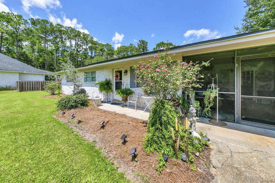 Charming 3BR/2BA Ranch on an Oversized Lot in the Heart of Freeport - No HOA! Discover the warmth and character of this beautifully maintained brick ranch situated on a spacious lot in a quiet, non-HOA neighborhood. Offering 3 bedrooms and 2 full bathrooms, this home blends vintage charm with thoughtful updates, creating a truly inviting and comfortable living space. Step inside to an eclectic, designer-inspired interior featuring updated flooring, fresh paint, and an abundance of natural light. The cozy living room is anchored by large windows and stylish finishes, creating the perfect gathering spot. The adjacent dining area flows effortlessly into the kitchen, where two-tone cabinetry, modern appliances, and rustic accents add personality and function. The primary suite offers generous space and a bright, airy feel, while two additional bedrooms provide flexibility for guests, family, or a home office. Both bathrooms have been updated with clean, modern tilework and fresh fixtures. Outdoor living shines here - enjoy a charming covered front porch, mature landscaping, and a spacious screened-in patio that overlooks the spacious yard. An outdoor pavilion is perfect for backyard barbeques and entertaining and hosting friends. With plenty of room for gardening, entertaining, or future expansion, the oversized lot provides endless possibilities. Located just minutes from schools, parks, shopping, and the bay, this property delivers the freedom of no HOA plus the comfort of a well-loved home.