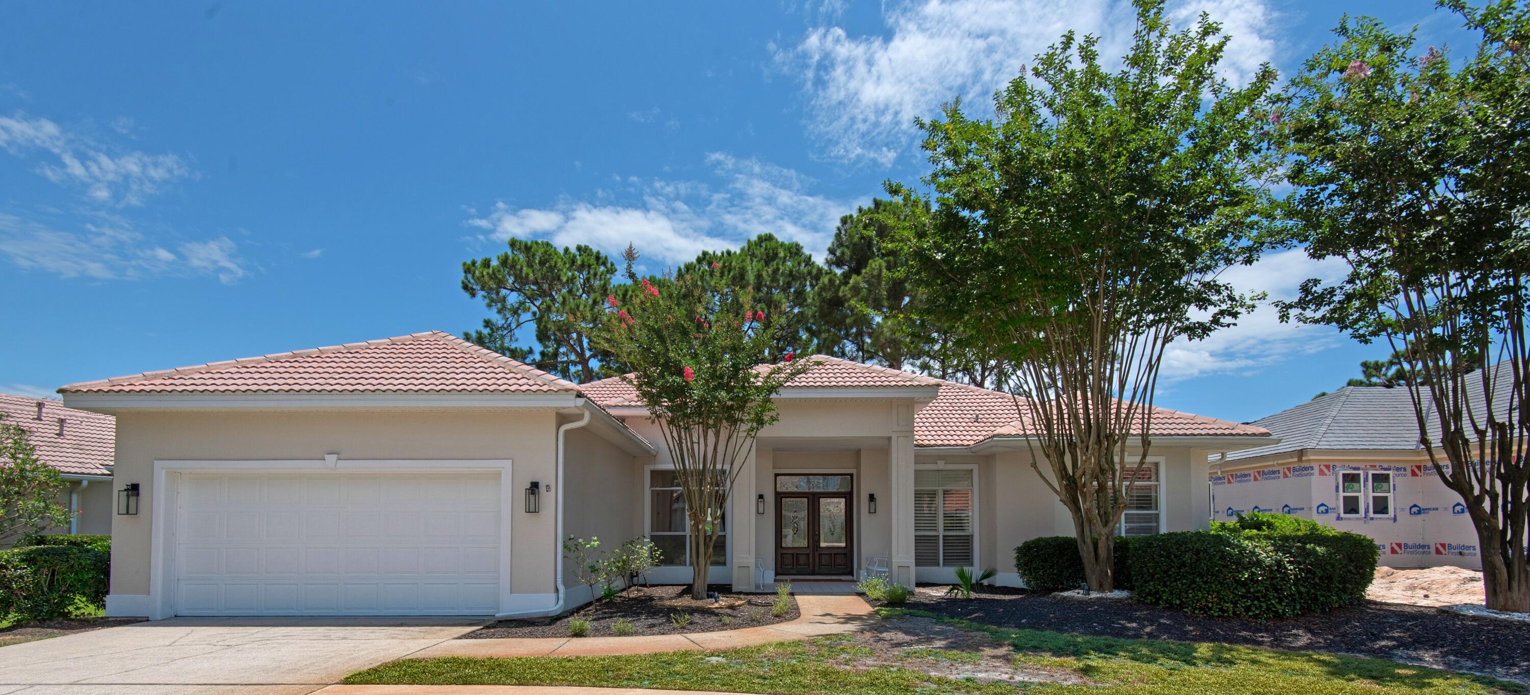 Under contract with a 72 hour kick out clause. Updates and modern finishes are at the forefront of this Emerald Bay home that sits on a lake, offering serene views. Offering nearly 2,500 square feet of living space and fresh Mediterranean styling in a guard-gated golf course community, this four-bed, two-bath home is the perfect blend of indoor-outdoor living with comfortable interiors and sliding doors that open onto a screened porch overlooking the water and the backyard. The kitchen has undergone a recent remodel with soft-close cabinets, granite countertops, custom tile backsplash and custom pantry shelving. The laundry also received significant upgrades including new soft-close cabinets and a custom built-in drop zone. New LVP flooring throughout the
