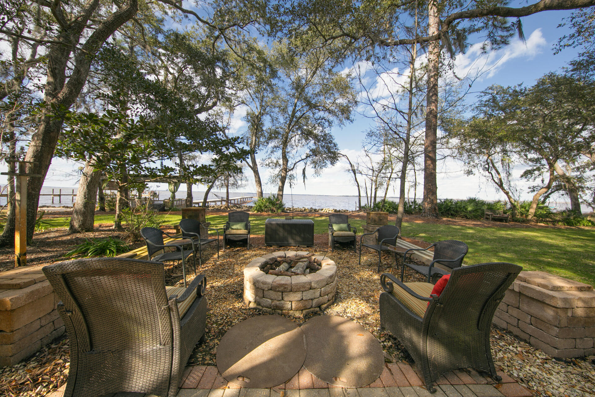 Bayfront estate with dock! Enjoy this +/-1.25 acre estate sized lot with 230 feet on the Choctawhatchee Bay. Nestled next to a nature preserve, this property includes a 3,033 square foot main house plus a 1,217 square foot guest house, providing the utmost in privacy and bay views. This meticulously maintained home provides views from the Living Room, Master Bedroom and Guest Bedroom. Indoor/outdoor living is easy with the heated and cooled patio. Outdoor spaces include a trellis bar, fire pit and boat dockHome interiors are well appointed with 12 foot ceilings in the Living Room and Master Bedroom. The living room features Cypress hardwood floors.The separate Guest Home contains two bedrooms, two bathrooms and a full kitchen, perfect as a mother-in-law suite.