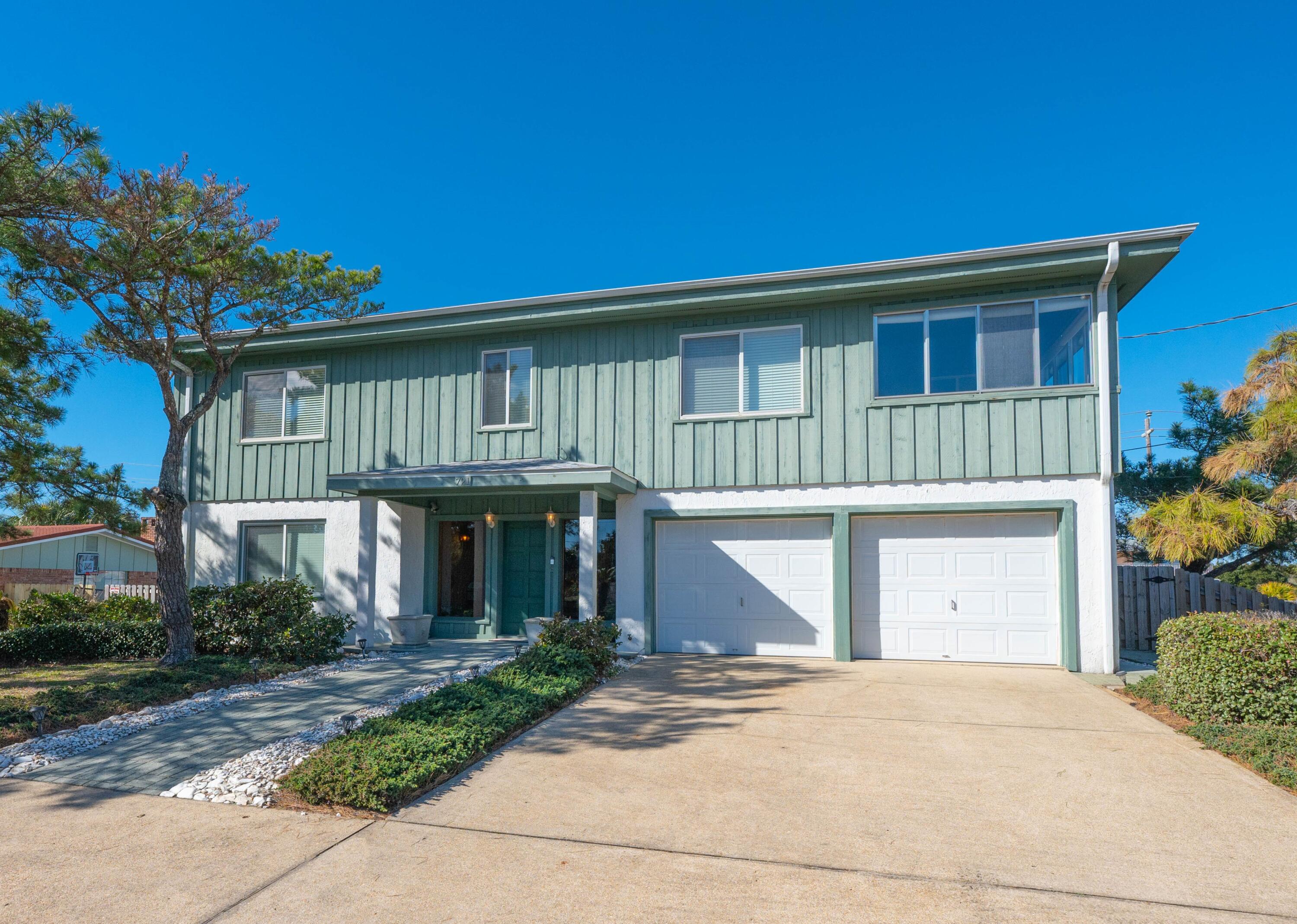 Sweeping unobstructed views of the Sound and Gulf from this spectacular 2 story custom built coastal home situated on a beautifully landscaped lot, featuring an oversized 32' x 16' pool, one block away from the pristine Okaloosa Island beaches, with direct Intracoastal Waterway access. The owner custom designed and engineered this 4-bedroom home for elevation from flooding (1st floor is 12'6'' above mean high tide and rests on a massive underground foundation) and structural integrity, using commercial grade framing & concrete materials and finishes including custom milled wide plank cypress wood walls throughout the home, Vermont slate flooring throughout the first level, and natural finished wide plank hard pine flooring on the 2nd floor. Upon entering, you are