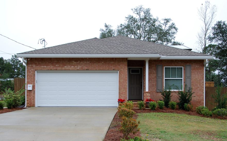 If you are searching for a one of a kind home with a separate, oversized garage big enough to accommodate an RV, watercraft or your small business' equipment...LOOK NO FURTHER! This 3 bedroom, 2 bath all brick home on a corner lot was built in 2014 by a custom builder as their personal home. The interior features include granite counter tops, stainless appliances, a breakfast bar and large walk in pantry in the kitchen, as well as marble counter tops in the bathrooms. The master bedroom features a tray ceiling and walk in closet, and the master bath boasts double vanities and built in shelving. The large back porch is screened and runs the entire length of the house, with patios on either side with plenty of space for a BBQ and/or hot tub. Don't miss out on this treasure of a home!