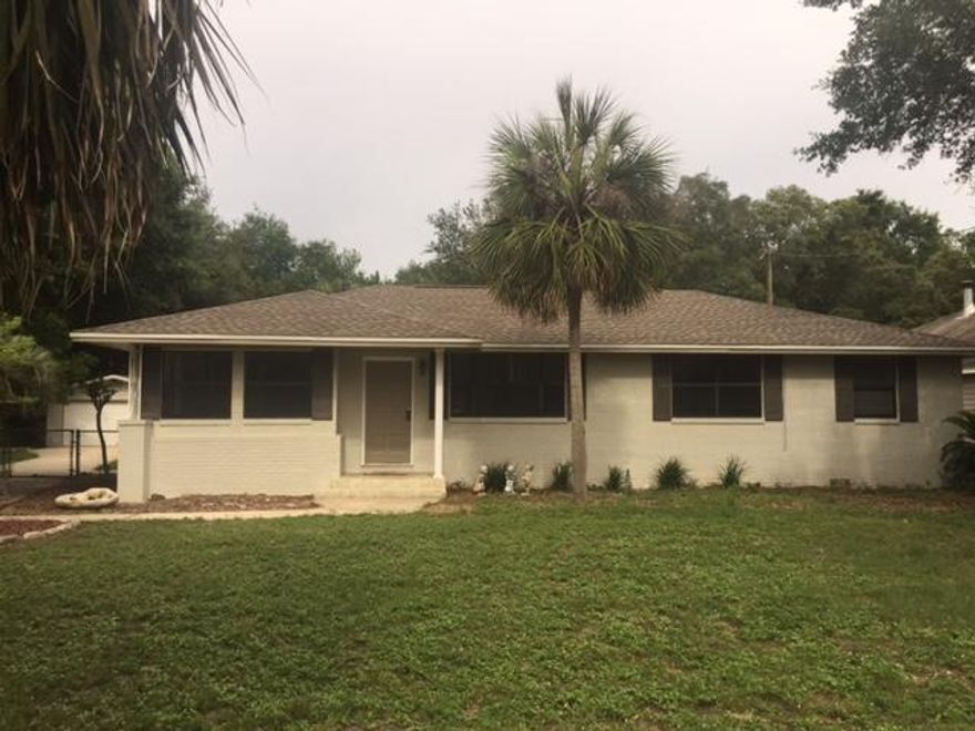 Four bedroom, two bath home with pool on half acre lot in Seminole. Lots of upgrade work for sale - $40,000 plus!!!: refinished wood floors in living area and hall bedrooms, fresh paint inside, new floor tile in both baths and hall, new French doors off kitchen, new hot water heater (gas) and new roof in 2016. In ground pool just resurfaced and very large detached garage/workshop with power: four vehicles will easily fit inside. Tall metal covering (pole type barn) for boat or rec vehicle in rear of lot. Screened in patio. Good size kitchen with plenty of cabinetry. No popcorn in the house!! Crown molding. Vacant and ready for new owner.