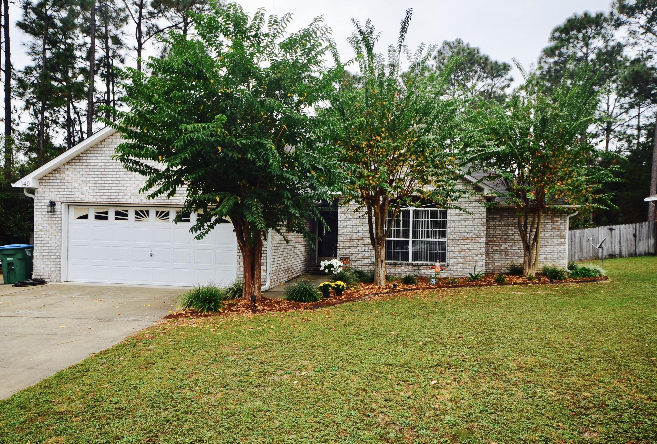Beautifully maintained, one owner home just behind the hospital and fire station! Convenience is key with this listing. All flooring replaced so no worry about carpet. Quick and easy to clean laminate and tile throughout. Large living room with gas fireplace, formal dining room, half bath all perfect for entertaining. Kitchen recently remodeled and all stainless appliances- gas stove! Breakfast bar and eat in area in the kitchen as well. Screened sitting room on the back and then a large deck and yard building with power as well! Split floor plan with huge master bedroom suite. Large soaking tub and separate shower. Have extra vehicles? They've got you covered there too with a large extended driveway. This home is move in ready!