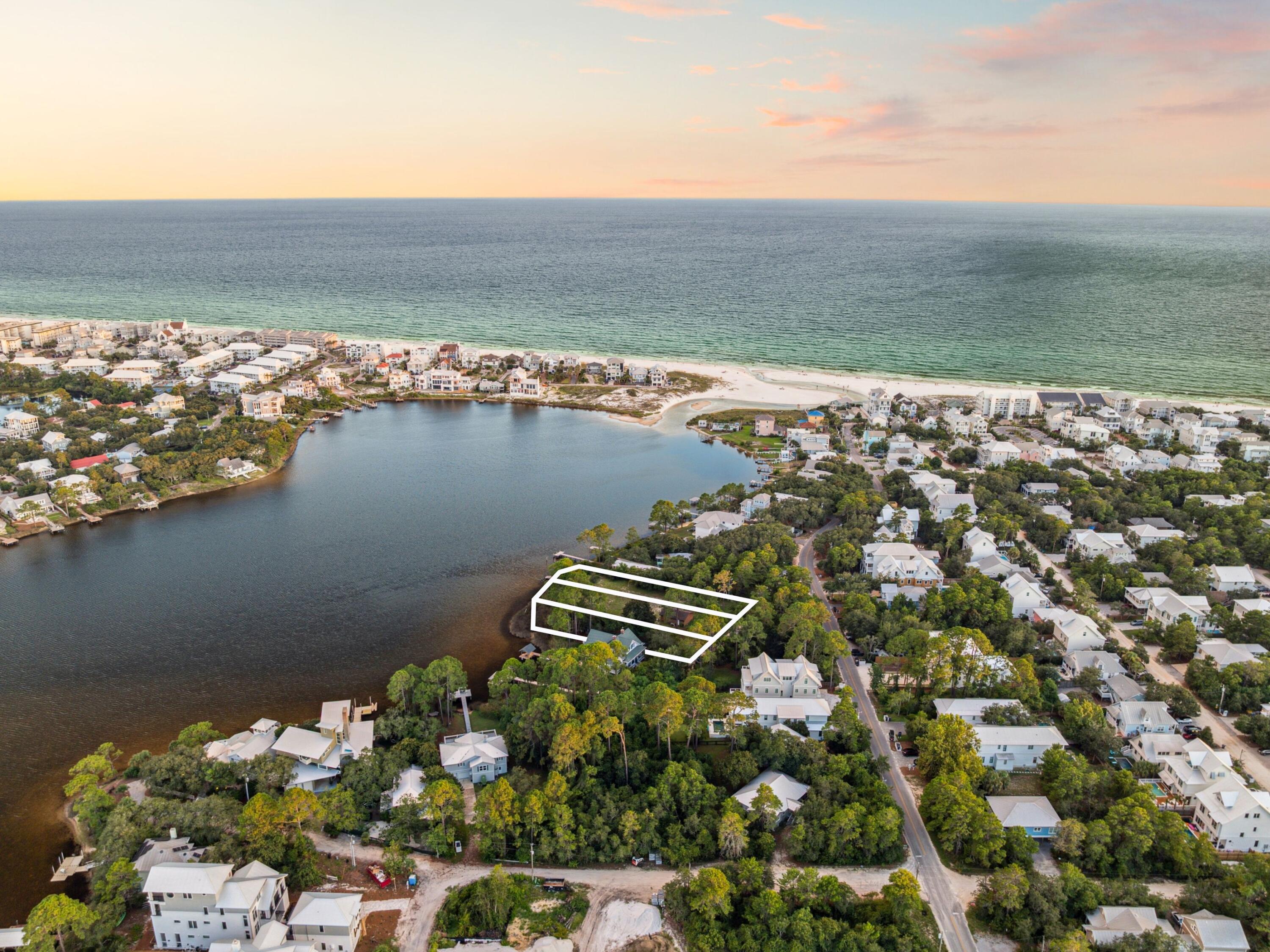 A truly exceptional opportunity to own a collection of three lakefront homesites on Eastern Lake, this offering includes Lots 9, 10, and 11--creating an expansive and private estate setting rarely available south of 30A. With over 300 feet of direct frontage on one of 30A's rare coastal dune lakes, this combined property offers unmatched scale, serenity, and potential for legacy development. Ideally situated in Seagrove Beach along the eastern stretch of Scenic Highway 30A, these lots provide effortless access to the Gulf, whether by paddleboard, boat, or a short stroll. From tranquil mornings on the water to sunset views from your future private dock, this is a setting designed for those who value privacy, nature, and refined coastal living.
This unique opportunity allows for the creation of a luxury waterfront compound, complete with a main residence, guest houses, pool, or additional investment properties. Surrounded by the charm of Seaside, the sophistication of Alys Beach, and the vibrant lifestyle of WaterColor and Rosemary, this location offers both retreat and connectivity.
Whether you envision a family legacy estate or an exceptional development project, the combination of these three lots delivers rare scale and timeless value in one of 30A's most iconic settings. Inquire today to explore the possibilities.
