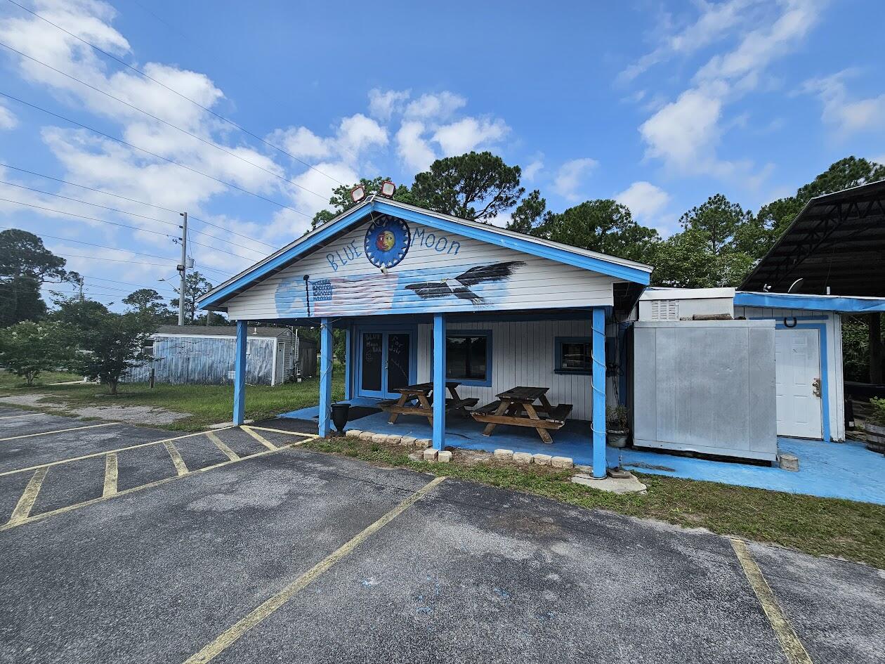 Unlock an exciting commercial opportunity in a rapidly developing area between Navarre and Fort Walton Beach, just west of Hurlburt Field. This location boasts strong drive-by traffic of 39,000 daily, ideal for a distinctive retail or business concept. The existing footprint, previously a beer and wine venue (Blue Moon Bar), is primed for your next entertainment endeavor. Future growth potential is enhanced by an adjacent proposed underpass to the west. The property also has a meandering creek on the west end that is ripe for use. All furniture and fixtures will be conveyed except for the pool table and juke box. Buyer to confirm all information relevant to their specific plans.