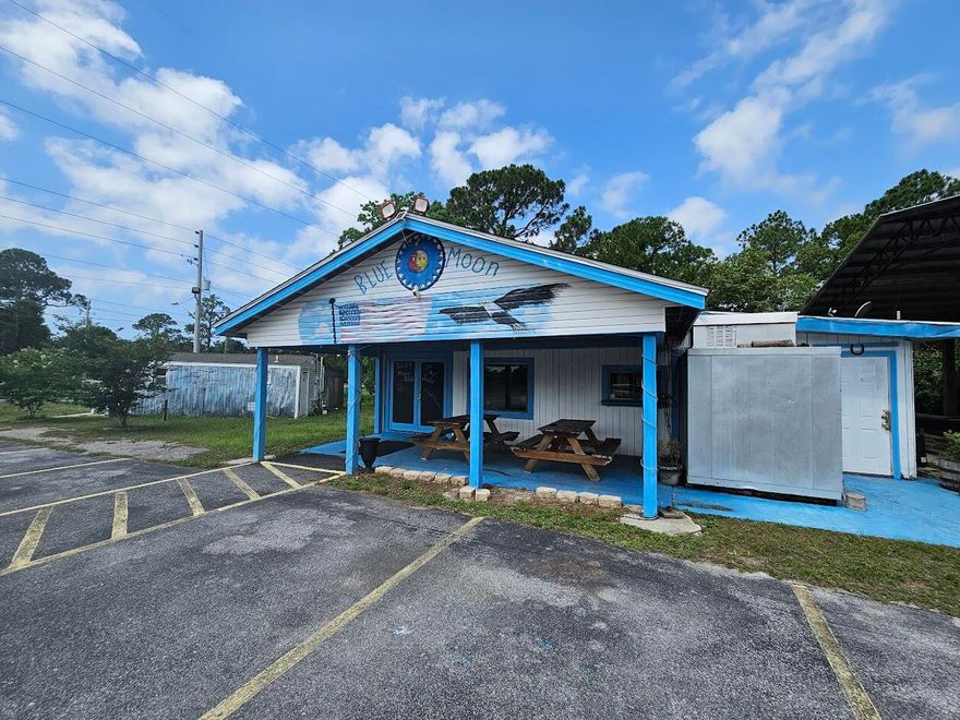 Unlock an exciting commercial opportunity in a rapidly developing area between Navarre and Fort Walton Beach, just west of Hurlburt Field. This location boasts strong drive-by traffic of 39,000 daily, ideal for a distinctive retail or business concept. The existing footprint, previously a beer and wine venue (Blue Moon Bar), is primed for your next entertainment endeavor. Future growth potential is enhanced by an adjacent proposed underpass to the west.  The property also has a meandering creek on the west end that is ripe for use. All furniture and fixtures will be conveyed except for the pool table and juke box. Buyer to confirm all information relevant to their specific plans.