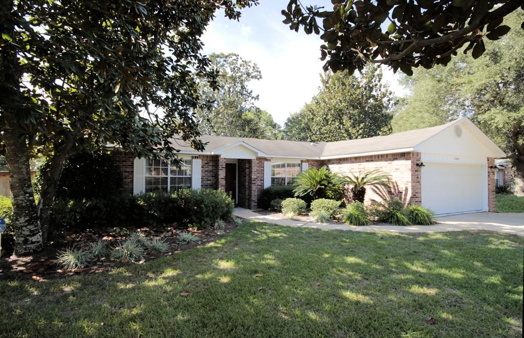 GREAT home with a NEW ROOF on a .34 acre corner cul-de-sac lot in the Bluewater Bay area of Niceville. This home also features floating bamboo flooring throughout for easy maintenance! Upon entering this home you will notice the beautiful bamboo floors throughout. The open floorplan and raised ceilings give the home a spacious feeling. The tiled kitchen features upgraded stainless appliances as well as a convenient breakfast nook overlooking the back yard. This is a split floorplan with the master suite on one side of the home and two additional bedrooms, a full bath and a laundry room on the other. The living room has French doors leading to the large screened porch and back yard. The large back yard is fully fenced and offers a yard building, a fire pit area a sprinkler system CLICK MORE