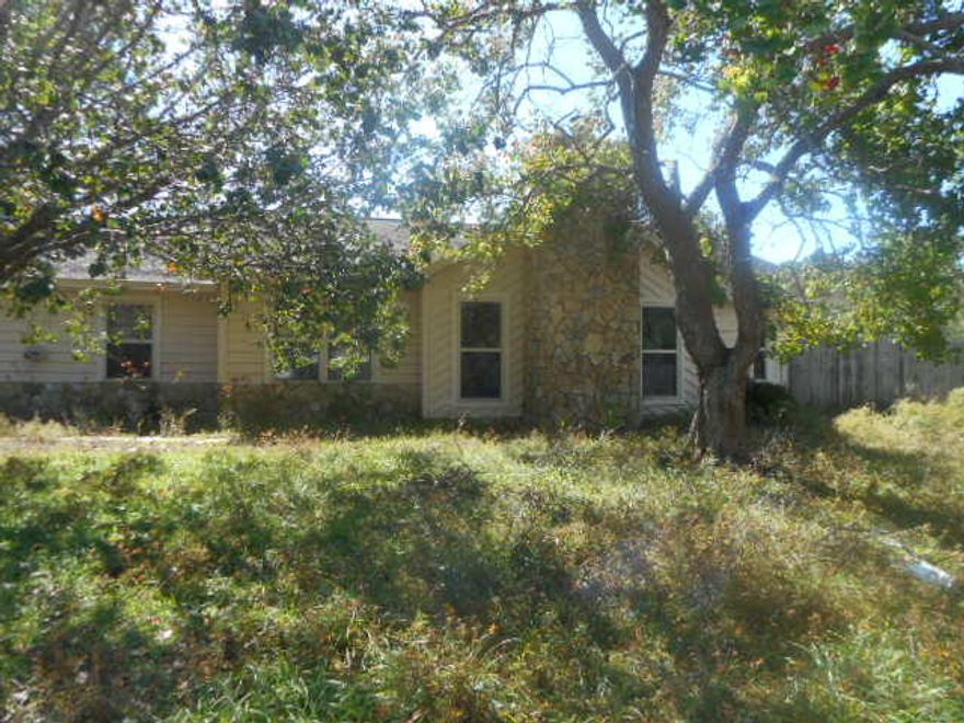 List price is $110,600.00Three bedroom, greatroom with stone fireplace and separate dining room. Updated kitchen. Two car garage that has been converted to one car with a hobby room. Large lot with storage shed.