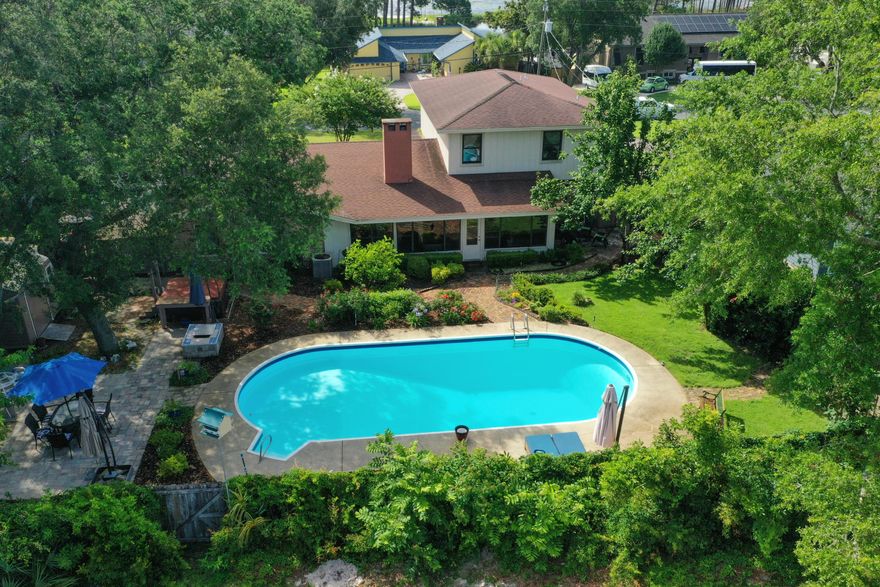 BACK ON MARKET - NO FAULT OF SELLER -BUYER FINANCING FELL APART DAYS BEFORE CLOSING. If you have been searching high and low for a 4 bed / 3 bath WITH A POOL IN SHALIMAR, here is your PERFECT house! New roof, ready to close! It really is one of a kind! A charming pool house on a beautiful lot with 4 bedrooms and 3 full baths in the heart of Shalimar is here! Upon entry you'll sense this is a unique opportunity with a cozy covered porch and entry way surrounded by greenery. This is a  custom-built home that offers character around each corner. You will have access to 2 master bedrooms, one downstairs and the other upstairs. Catch a view of Choctawhatchee Bay from both bedrooms upstairs. 2 living room spaces, one with a formal feel overlooking the courtyard up front and a second living space tucked away in the heart of the house with a gas fireplace. Upgraded kitchen with new stainless appliance(a gas stove!) and cabinets. The kitchen offers eat in space but walks into a full dining room for more of a formal setting. Now, for the FUN part. Enjoy a heated and cooled Florida room overlooking your sparkling pool, let the paver walkway lead the way! Surrounded by beautiful landscaping, you'll love spending your days into nights at your private little resort complete with a gas fire pit and a hot tub! Behind your privacy fence is the Shalimar Point Golf Course so privacy is the bonus. This home is copper wired Oversized parking for your boat and RV. Schedule your showing today because this one is a GEM!