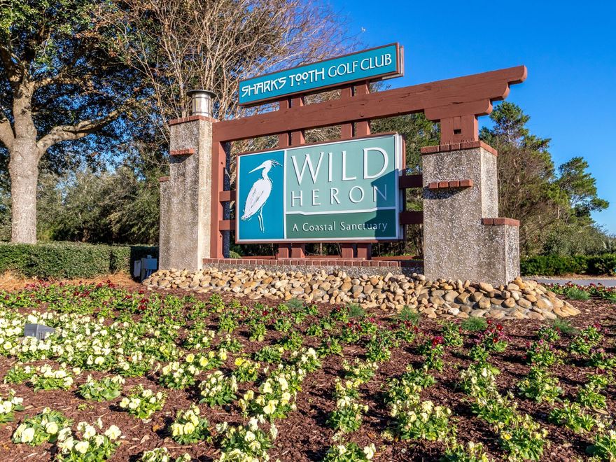 Build your dream home in beautiful Wild Heron, a 700+ acre Coastal Sanctuary situated on Lake Powell.  This lot backs up to fairway 7 and the conservation area.  Enjoy the privacy of a wooded lot, while also taking advantage of the many Wild Heron amenities including community pool, boardwalk walking paths, boat house with kayaks and paddle boards.  NOTE:  Seller also owns adjacent lot which may be available for purchase also.