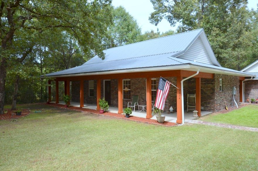 You are going to LOVE this property! So close to town with seclusion. Home rests on 1.05 acres and was custom built in 2012. This property has all that you are looking for - metal roof, brick siding, open porch in front and back with separate decked area which is perfect for enjoying the solitude or roasting marshmallows. This 3 bedroom 2 bath home is fairly unique in design. Open floor plan concept with large living are with vaulted ceilings and craftsman wood on the ceilings; dining are that opens to the kitchen and the rear decks, and a kitchen to die for. Adorned with granite tops, soft close cabinets and drawers and all stainless steel appliances. The side entry detached 2 car garage is spacious and can park most all vehicles. This one is one to see and just mins from town!