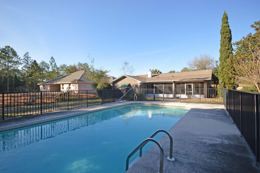 Peaceful Pool Home in Holley by the Sea. Spend time with family and friends entertaining by the Large 36x18 Gunite Pool and entertain in the 270 sq ft Screened in Lanai. Outside the Lanai is the pavers area for an open patio for extra overflow room that is an entertaining dream! Your new home features 4 bedrooms and 2 full baths with a split floor plan. A large living room offers hardwood flooring and a brick wood burning fireplace with mantle. The vaulted ceiling adds to the large feeling of the room. The large open kitchen features blonde maple cabinets with solid surface countertops, tile floors, and again vaulted ceilings. Overlooking the pool area is the large breakfast area with French doors! A Large Master suite features French doors that lead out to the Lanai. The Master bedroom features two large closets, double vanities, Hurricane shutters, and updated lighting!  The 3 additional bedrooms are separate from the Master for added privacy for guests. The shaded courtyard is inviting and peaceful. 19" tile adds to beauty and functionality. You'll find ample storage and cabinet space in the kitchen and throughout the entire home. Hvac is 2015, and the windows and doors added after 2015;  Come enjoy your new home, complete with endless possibilities for family fun and entertaining! Also enjoy the Multi-million $ recreational center at HBTS!