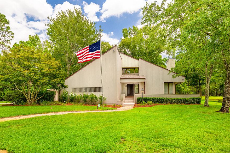 STUNNING one-of-a-kind custom built home on approximately 10 acres inside the city limits and 1 mile from the airport. This property features a lovely pond nestled in front of the home stocked with bream and bass! You will enjoy watching the wildlife abound when relaxing in the gazebo situated perfectly over the pond or perhaps you would start your morning fishing off the dock. This home is one of the finest in Defuniak, it is thoughtfully designed, superbly executed and meticulously maintained. The entrance is remarkable with a tree lined paved driveway and as you begin to lay eyes on the front, you can see the porch that surrounds and overlooks the stocked pond, straight from a story book!