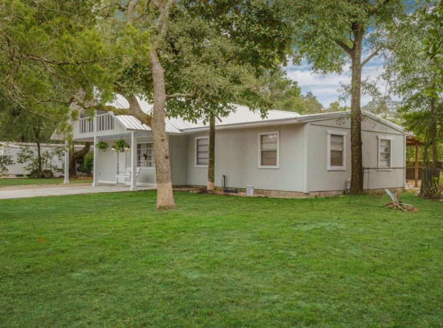 Amazing opportunity to own a beautiful 5 Bedroom home which is close to the Base and the Beach, the Beach has a Boat Ramp that can be used by the public.This Home has a Brand New Metal  Roof, New Hardie Boards Siding, New Paint.  Which is great for either VA, FHA or Conventional Loan. Home Warranty available.The house seats on a huge Corner Lot. This home has a lot of Space which will produce great income for SHORT TERM RENTAL or LONG TERM  RENTAL. Do not miss your opportunity to own a property in paradise for such an affordable price.