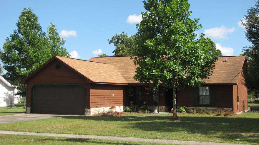 COUNTY TAXES AND SOUTH OF I-10...this cute 3 bd/2ba home is situated on a nearly half acre lot...huge fenced-in backyard with storage shed (which has power). The open floor plan boasts a large living room with wood-burning fireplace and kitchen with center island. (Refrigerator does not convey.) A roomy eat-in dining area adjoins the kitchen. The master bedroom measures approximately 13'5'' x 14'7''. New roof in 2005. Enjoy the convenience of being close to the interstate, within 30 minutes of the Emerald Coast's beautiful beaches and also a quick commute to military bases. School zones were confirmed with the county website. Please have buyer verify as they are subject to change and any other areas of importance. Property is being sold in ''as is'' condition.