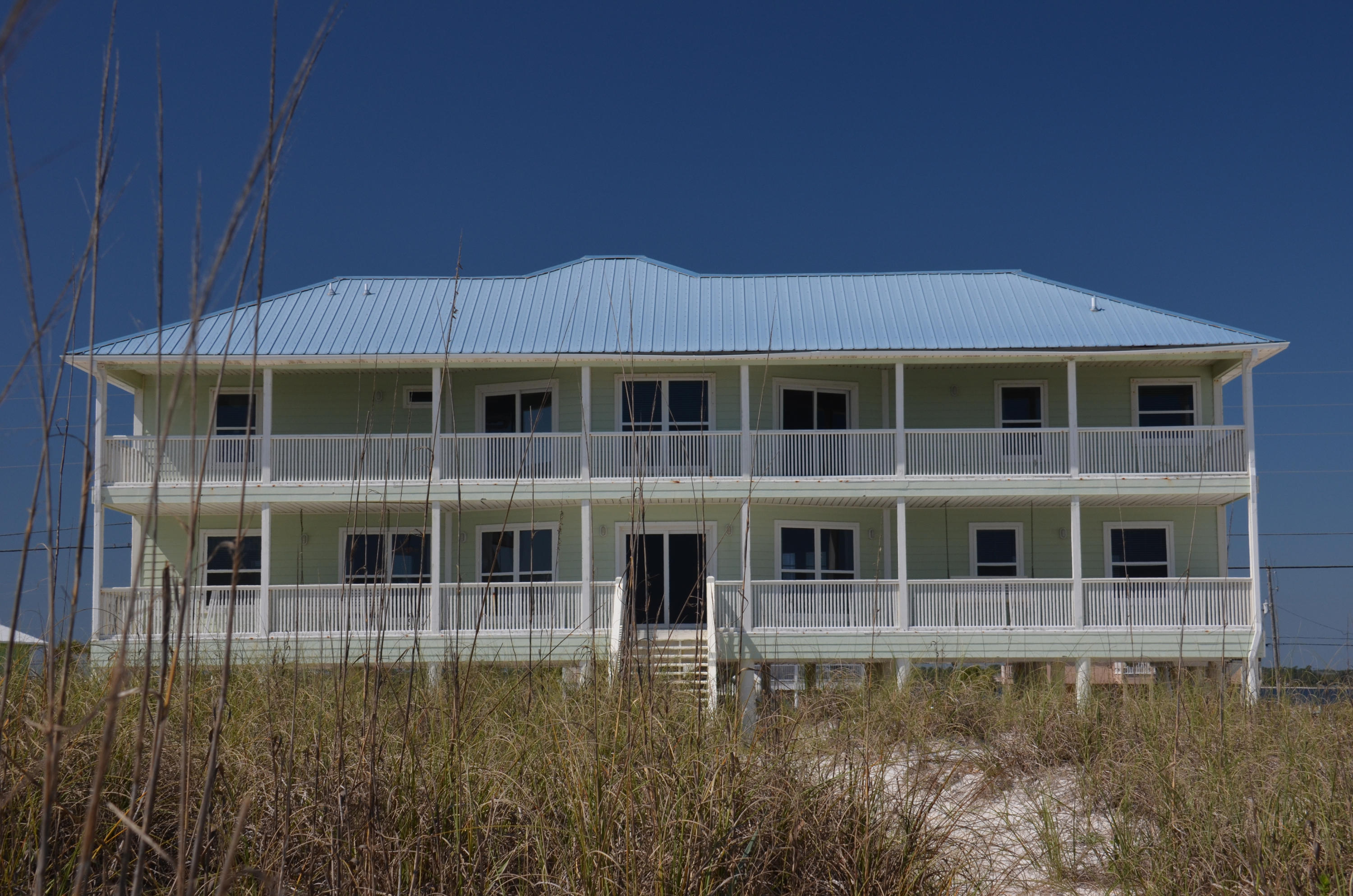 SELLER HAS JUST REDUCED by $400,000! SHORT SALE. GULF FRONT. Beautiful Gulf Front home located on 100ft wide lot with 4 Bedrooms and 3 Bathrooms. Home features 4 Gulf Front decks on 2 levels to take in the Panoramic Views of endless Sunrises and Sunsets on Navarre Beach. Uniquely laid floor plan features Gulf Views from all Living areas and ALL 4 Bedrooms. Some of the other features include an 18'' Tiled and Knotty Pine Floors, updated Kitchen with 2 dining areas and Gulf Views, over sized living room with Gulf Views, All 4 bedrooms boast Gulf Views, Large lot with plenty of space for parking and more. This one of kind homes comes fully furnished (some exceptions) and ready for you and your guests. Navarre Beach is Florida's best kept Secret. Featuring Gulf Islands Seashore, bike and walking trails, restaurants and shopping nearby and no crowds.
Make an appointment today to see this one of a kind home