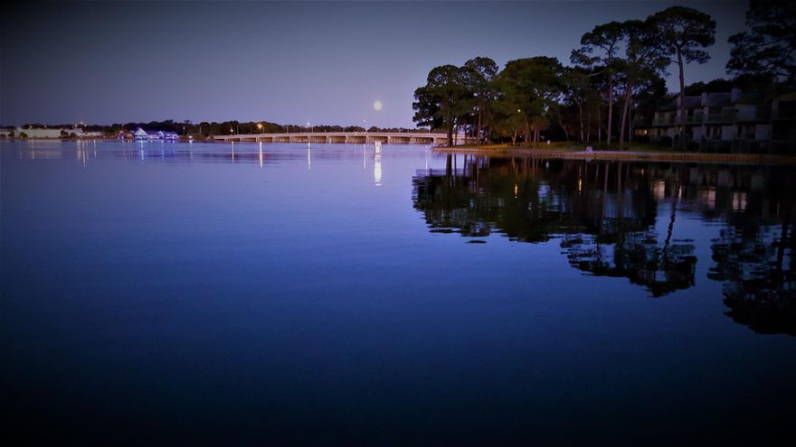 Large waterfront home on highly sought after Cinco Bayou with deep water slip and high elevation. So much charm! New dock and decking constructed with marine grade wood and all new boat lift. Multiple outdoor living spaces with patios and decks. The spacious living room has a gas fireplace highlighted by custom built-ins and it opens into the enormous kitchen, breakfast nook with window seating, and dining room. This house is perfect for entertaining inside or out with beautiful views of the bayou and the yard that can be seen through so many large windows and accessed through multiple doors. Split floor plan with master bed and bath that opens onto one of the three patio/decks. Three bedrooms, including a second master with bath and a third bath on the other side of the home. Newer