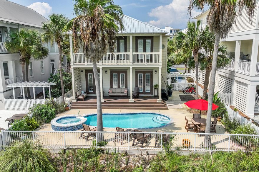 This Stunning beach house is an opportunity not to be missed! Whether you're seeking a beach home oasis for memorable vacations or year-round coastal living, this home caters to your every desire. Nothing has been overlooked in this coastal retreat. The first floor features an open living, dining, and kitchen area that open out onto the deck with the pool and spa overlooking Lake Caroline; creating a seamless flow between indoor and outdoor spaces. The residence has three full bedrooms, plus a bunkroom with four twin-sized berths. Wonderful details are at every corner, from the re-claimed hardwood floors and driftwood mantel; to the thoughtfully appointed artwork and accessories throughout that create a sophisticated ambiance. Enjoy afternoons relaxing on one of the four porches.... ... or expansive pool deck that are ideal for enjoying the sea breeze and scenic surroundings. Destin Pointe is renowned for its incredible amenities and natural beauty, and this home perfectly encapsulates the allure of this sought-after community. Destin Pointe boasts two community pools, tennis & pickle ball courts, shuffle board courts, two lakes, and more than 3,000 feet of beachfront.