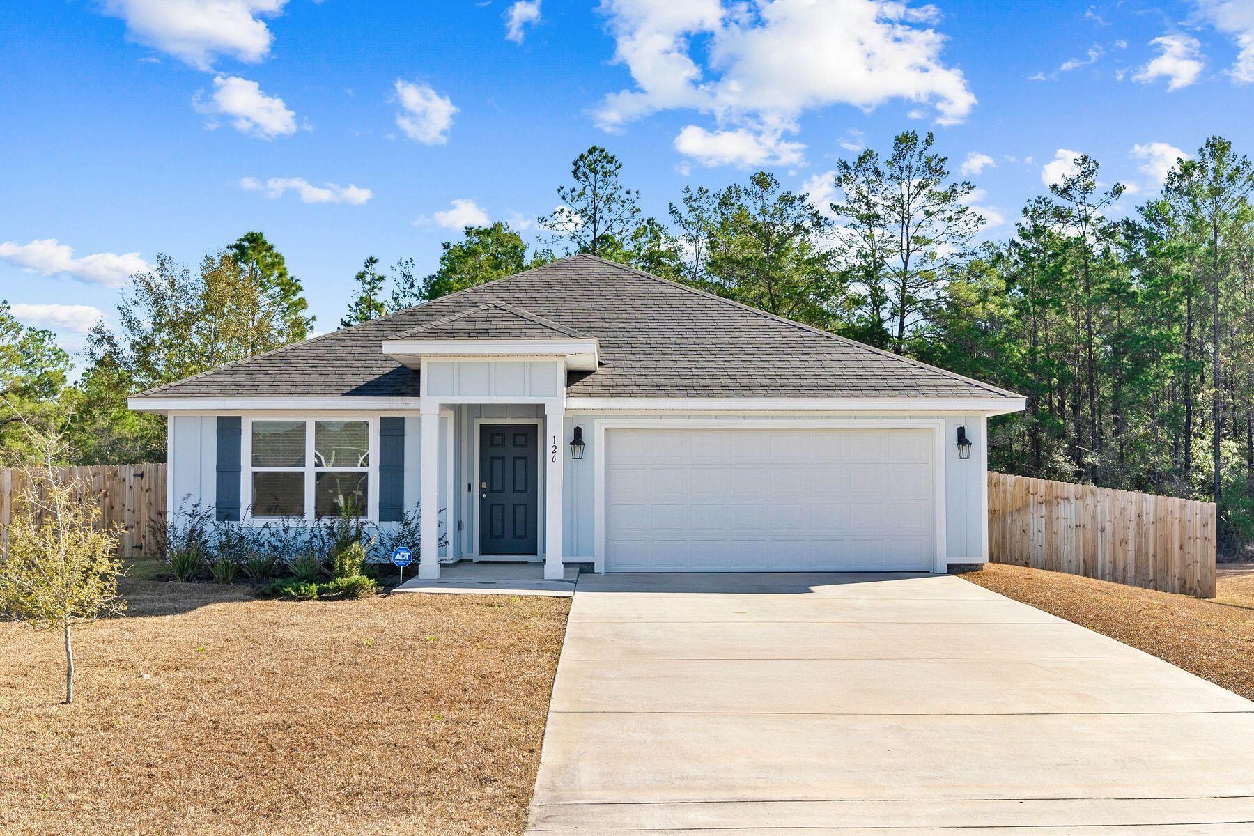 Situated in the peaceful Ashton Park community of Freeport, this four-bedroom, two-bathroom home has been thoughtfully updated for modern living. Its prime location provides easy access to Highway 20, Highway 331 and Interstate 10, while South Walton's beaches are a short 25-30 minute drive, and Panama City Beach is just 45 minutes away. This Cali floor plan showcases an open design with luxury vinyl plank flooring throughout, eliminating the need for carpet. The kitchen impresses with granite countertops, ivory shaker-style cabinetry and soft-close drawers, while the primary suite offers a spacious ensuite bathroom with a tub and a generously sized closet. The backyard is fully fenced and enhanced with a smart sprinkler system, creating a private oasis for outdoor activities. A covered porch invites relaxation or gatherings, while the home's modern upgrades include brand-new blinds and a whole-home smart system for effortless convenience. Ideal for families, pet owners or those who work from home, this property offers quiet living in a neighborhood with sidewalks perfect for evening strolls. With its proximity to schools, shopping and local churches, this move-in-ready home is a fantastic opportunity for anyone seeking comfort and practicality in a peaceful setting.
