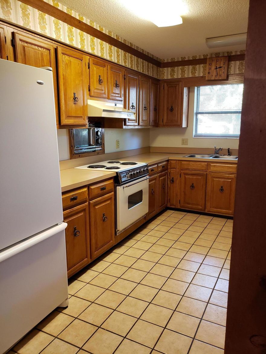 DEAL ALERT! What a fantastic opportunity to own a 4 bedroom 3.5 bath home near the back of Destin with no HOA. This home includes a large living area with stone fireplace, dining area, Florida room, utility room, nice kitchen with bar and a nice back yard. The roof also has hurricane clips. Home will need some TLC and updating and the possibilities are endless on what can be done to spruce this home up. Home is being sold as is and all measurements are approximate. Buyer to do their own due diligence.
