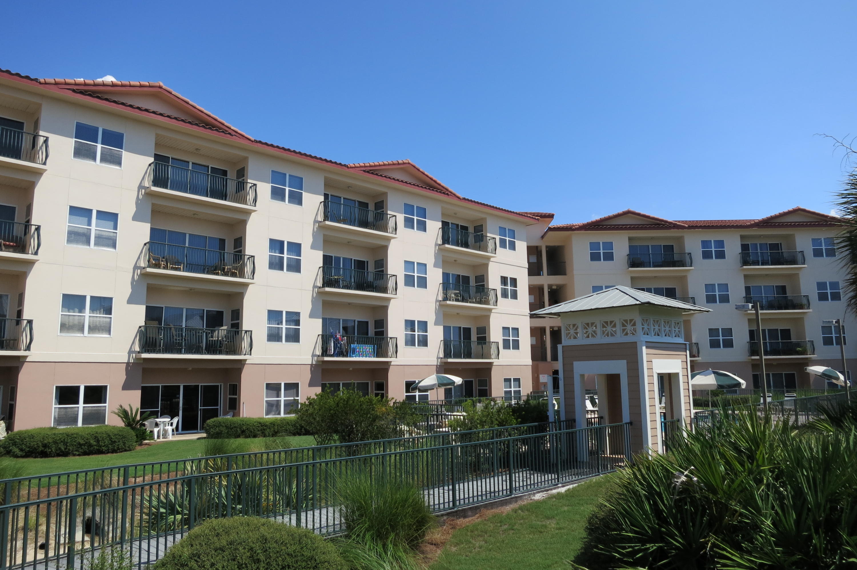 This totally remodeled unit is directly across the street from the beach! Any closer would be beach front! Everything has been updated in this unit to make it like new! You must see for yourself the custom upgrades. They include totally redone kitchen and baths, including refaced cabinets, plumbing fixtures, and beautiful upgraded high end granite. The kitchen has new appliances, including a fabulous refrigerator, disposal, & granite composite sink. Master bath has been totally remodeled to include a nice large tiled shower & linen closet. Also throughout you'll find new tile, carpet, paint, lighting, fans, crown molding, curtains and plantation shutters, and screens. The AC unit and water heater have also been replaced & just inspected. This unit has not been a rental. However, other units in this complex are popular rentals, potentially grossing $18,000-$20,000 annually. The beautiful swimming pool and hot tub are steps away from your back patio. There is deeded beach access directly across the street. The exterior of the complex has just been freshly painted and all windows caulked. The condo is centrally located and convenient to wonderful restaurants, some within walking distance, outlet shopping, golf, fishing, boating and all other water sports. This is the only first floor unit available at this time! Make your appointment today!