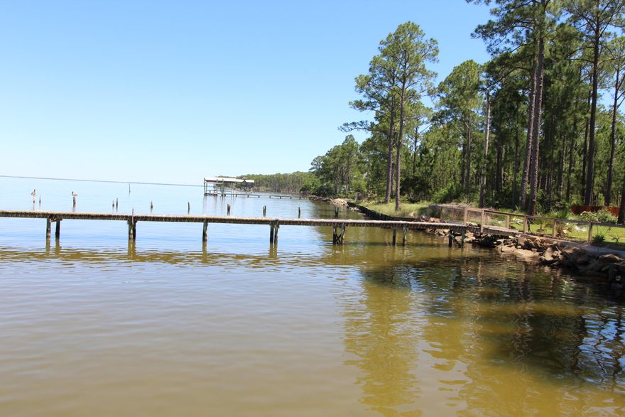 BAY FRONT LOT!! BUILD YOUR DREAM HOME ON THE CHOCTAWHATCHEE BAY. WONDERFUL WATERFRONT LOT WHITH LARGE PINES, ON PAVED ROAD AND HAS NICE OWNER OCCUPIED HOMES AROUND. SEAWALL AND DOCK IS IN PLACE. CLOSE TO SANDESTIN FOR OUTLET MALL SHOPPING AND HOSPITAL. MANY NEW HOMES ARE BUILDING.
