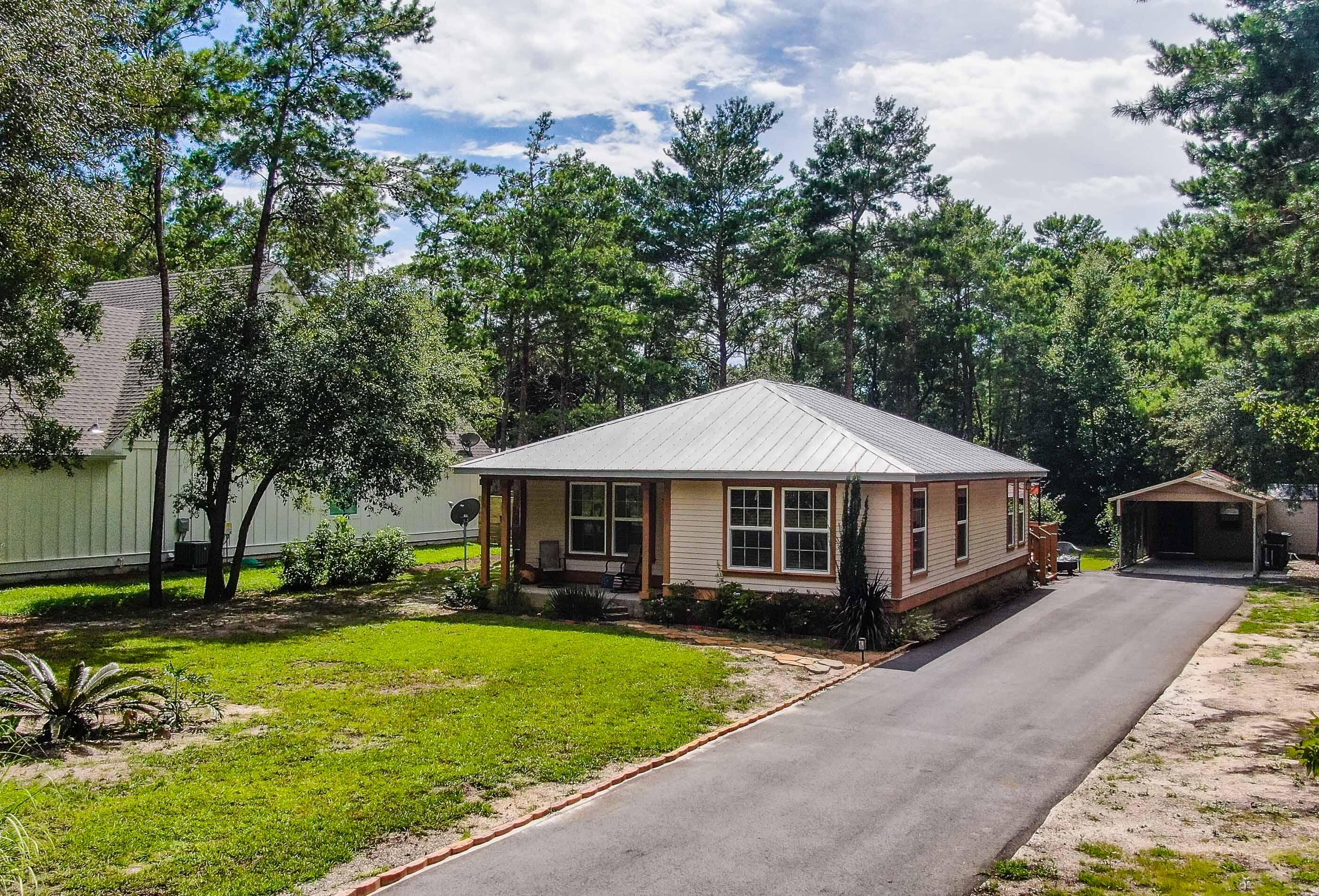 Welcome to 475 Ricker Avenue! Located in beautiful up and coming Point Washington FL, just North of the highly sought after 30A and Grayton Beach area. This cottage style home is meticulously kept and is a perfect buy for a first time home buyer or investor. This home was built in 2011, and offers ease of maintenance and comfort. Offering tile flooring, metal roof, new A/C, new yard pump and Rinnai hot water heater, just to name a few There is plenty of room to add a garage/apartment or pool on the property, and plenty of room for your boat or RV! Only 10 minutes to the beaches of South Walton and located in a non-HOA subdivision this home is close enough to all of the fun and entertainment, but just outside of the hustle and bustle. Call for your viewing appointment today!
