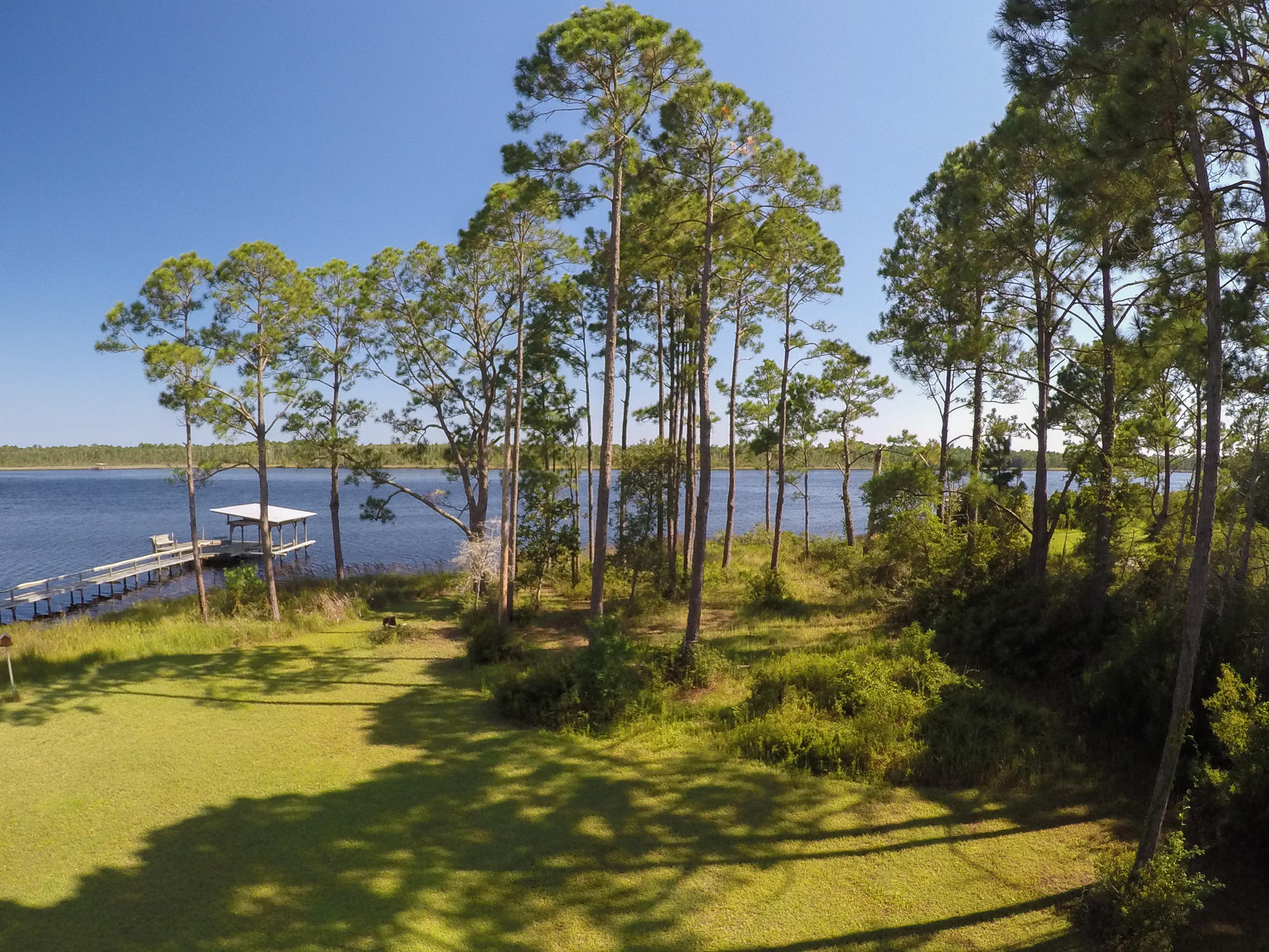 2.8 Acres and 160 feet on the Bay! Design your weekend retreat or personal home from the top down to take advantage of the opportunity to build to today's construction codes and standards as well as your family's lifestyle. This wonderful lot is conveniently located on East Bay and just a short drive to Navarre Beach. Navarre is nestled perfectly between Destin and Pensacola which offer some of the finest in casual and fine dining, shopping and entertainment on the Emerald Coast. We invite you to learn more about the exciting opportunity to build your Florida dream home on the bay in Navarre! Survey available upon request. No association fees. AE flood zone