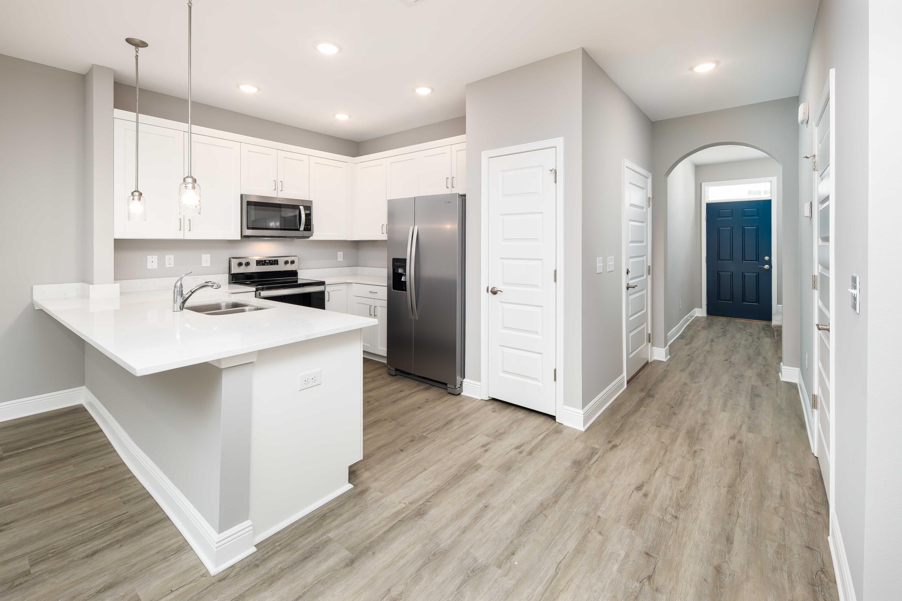 Make an appointment to come view this brand new townhome for sale in Fort Walton Beach and ask your favorite agent about builder incentives and closing cost assistance! Orange Place offers 26 units in total, each with 3 bedrooms/ 2.5 bathrooms with an individual garage. This is Unit 319-20, which is the seventh unit on your left. Downstairs you will find the living room, half bathroom, and a contemporary kitchen complete with Bianco Carrera Quartz countertops, soft close cabinets, and stainless steel appliances including a fingerprint resistant stainless steel side by side refrigerator. You will find LVP throughout the living and bathrooms, and plush carpet for comfort in the bedrooms. Only a short drive away from the beaches, shopping, restaurants, Air Force Bases and more.