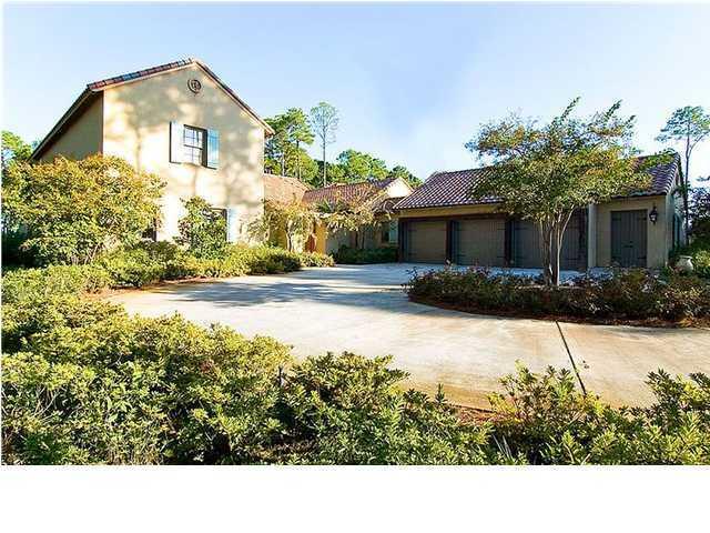 Price reduced for quick sale on this custom designed home in BURNT PINE. Exterior features include stucco walls with custom faux finish, clay-tile roofing, cooper gutters and wrought iron fixtures. The details in this home are at every turn. Reclaimed cypress doors, private courtyard, 48-inch wood burning fireplace, cypress book cases, 2x14 aged heart pine flooring, and limestone arches. Chef's kitchen include 10-foot island, 48-inch Wolf gas range, Sub-Zero frigerator/ freezer, Whirlpool ice maker and compactor, Bosch dishwasher, Hans Grohe faucets, stainless steel sinks, and walk in butler's pantry with wine cooler. A 3-car garage with over-size bays(11 x 25)with a work room, work bench and built in cabinetry. Enjoy the breeze on the covered porch over looking the golf course and pool.