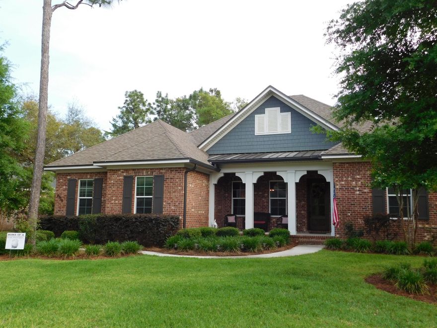 2010 Model Home in prestigious Swift Creek. Brick with hardi plank accents and impact glass throughout - yes - hurricane ready! Open and spacious with 10ft. ceilings, and 8ft. doors, crown molding, an added touch, brick accent wall in the dining room. Five Bedroom, three and a half bath. The 5th room is centrally located and designed as a flex room for use as and office, music room, game room or whatever the new owners need the room for. Split floor plan, with different wings in the home for the bedrooms. Large separate laundry room with cabinets and a laundry sink. Kitchen is beautiful with custom cabinetry, bar seating, granite counters, corner pantry, and a breakfast area for all your dining needs. Custom window shades. Speaking of entertaining...This home has a custom designed lanai.