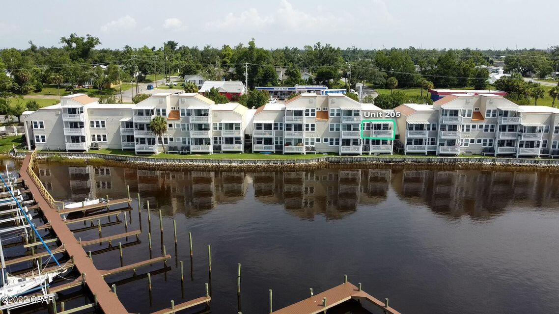 Watson Bayou waterfront 1BR/1BA with Boat Slip with Gorgeous views. This Condominium has been a completely redone with flooring, stainless steel appliances, counter tops, cabinets, vanities, lighting, doors, walls, windows, sliding glass door, AC, water heater and pier/boat slip. Gated Community. Built 1985 just redone from Hurricane Michael. Large balcony to watch the dolphins go by. All dimensions are approx.