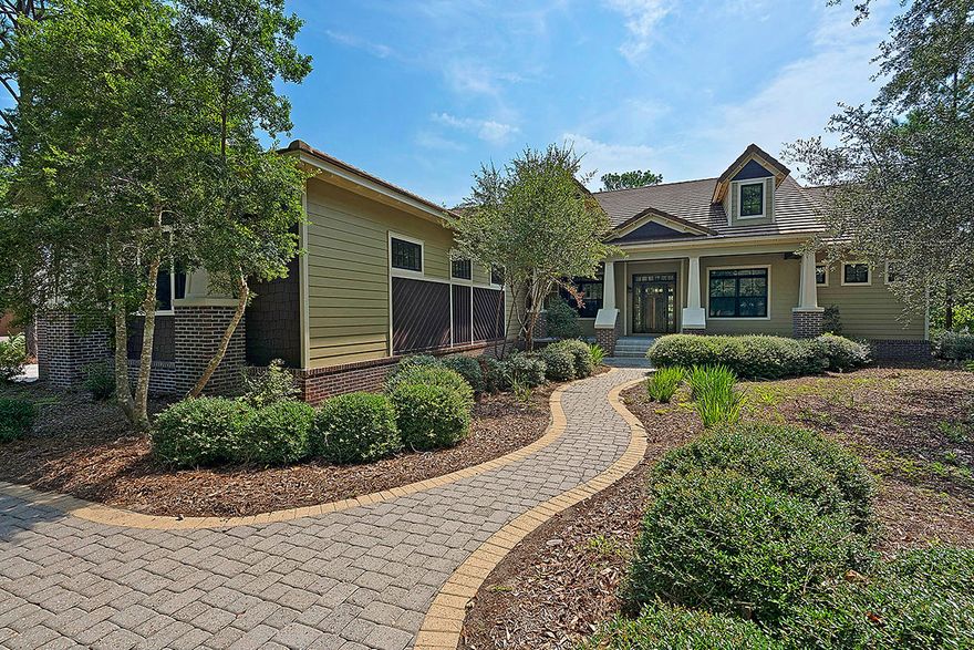 THIS EXCLUSIVE DESIGN AND CORNER LOT ENJOY A MODERN STYLE WITH LIGHT MOVEMENT AND OPEN SPACE. The Foyer panorama focuses on the vaulted Living area with the Dining Room and adjacent den expanding the entertainment agenda. The Kitchen with breakfast nook in a Bay Window host an island and view the woodsy landscape. Split Bedrooms feature a Master Bedroom with en suite bath in the East Wing and two Guest Rooms with en suite baths in the West Wing. The 3 car garage provides ample storage. The Living areas and several Bedrooms flow through multiple French doors to generous front and back porches. The gated community of Wild Heron fronts Lake Powell with a plethora of amenities including Boathouses, Pools, Parks, Golfing, Bike Paths and more.