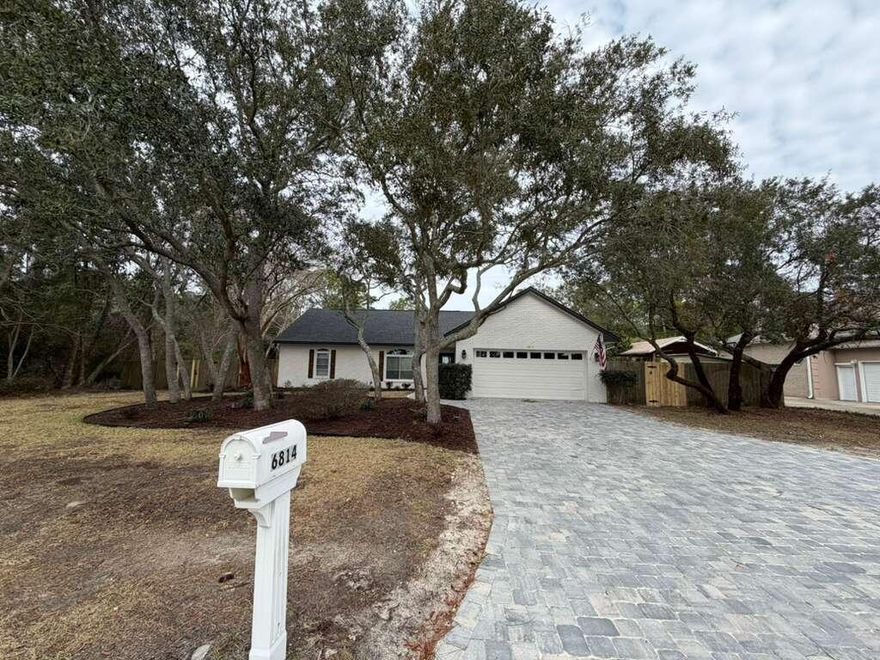 Professional photos soon! Turnkey Navarre gem with water views! Completely updated and move-in ready, this stunning 3-bedroom, 3-bath, 2-car garage home offers approximately 2,500 sq ft (MOL) in one of Navarre's most prestigious neighborhoods. Every major system has been done -- New roof & AC (2025), New hot water heater, and new paver driveway, so you can buy with confidence. Enjoy a 4-year-old pool, a fully remodeled interior with a brand-new kitchen, new flooring throughout, updated fans and lighting, textured ceilings, and beautifully renovated bathrooms (4 years ago). Situated on a great lot directly across from the water, this home delivers style, comfort, and peace of mind in a prime location