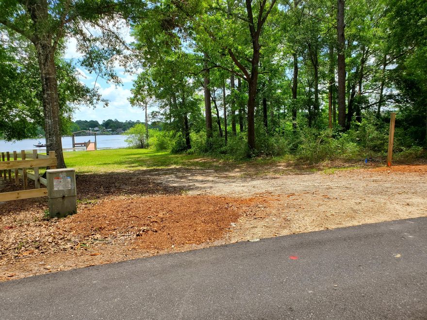 A PIECE OF YOUR OWN ISLAND!  It's rare to find a lot on Juniper Island for sale.  This .27 acre wooded lot can be yours to enjoy forever.  DeFuniak Springs is less than an hour to the most beautiful white beaches in Florida. Enjoy the water all the time. Why wait?  Purchase this one before it's gone. Buyer to verify all measurements, utilities and other matters of importance.