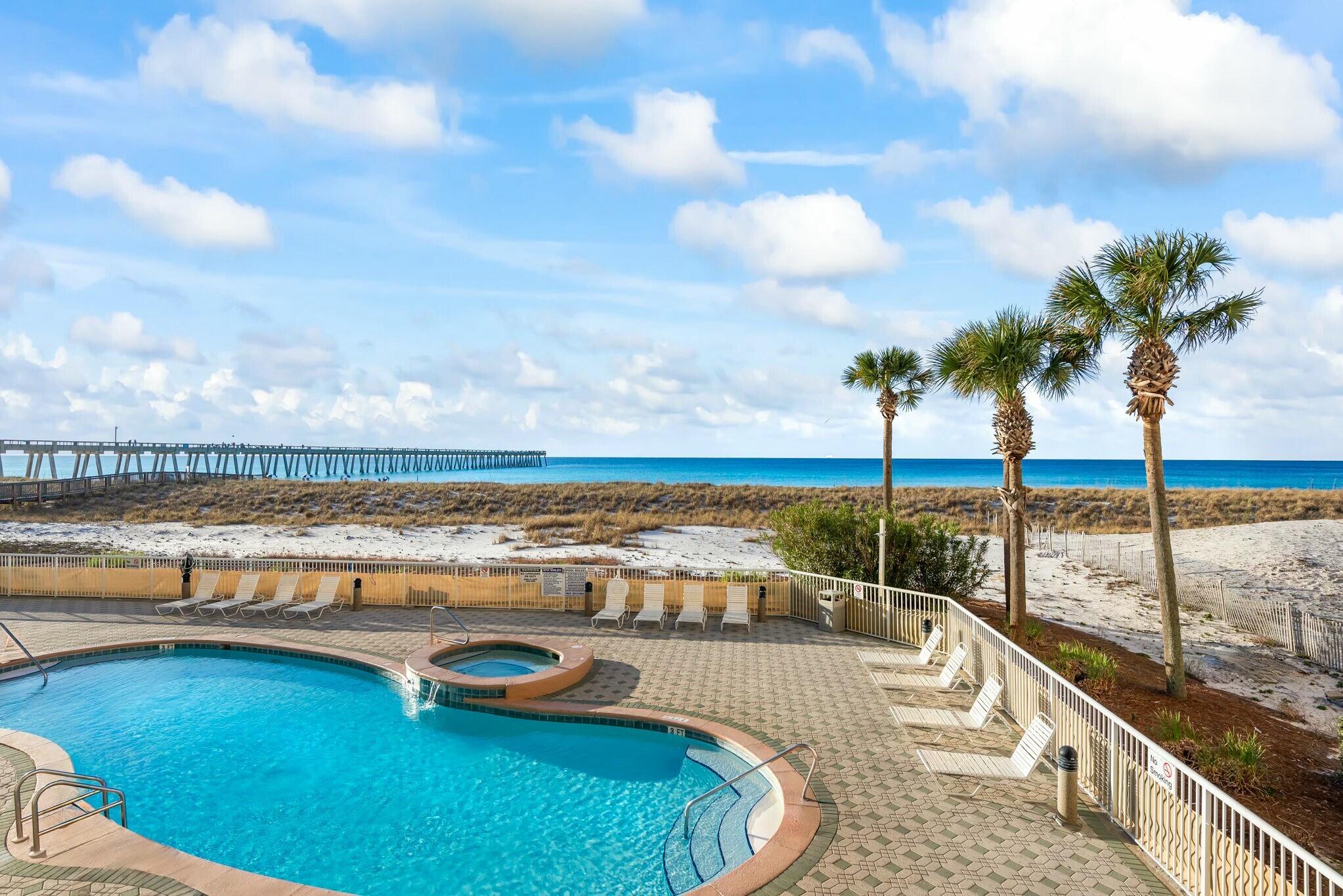 Impeccably maintained and updated, this fully furnished Gulf-front condo offers the perfect blend of comfort and style. This 3-bedroom, 3-bath corner unit features soaring 12-ft ceilings and a spacious wrap-around balcony, ideal for both relaxation and entertaining. Floor-to-ceiling sliding glass doors in the living area provide breathtaking views of the crystal clear Gulf waters. All new tile floors have been installed throughout. The kitchen boasts all new cabinets and hardware and is equipped with stainless steel appliances, granite countertops, and a pantry for added convenience. A new full-size washer and dryer make laundry a breeze. The master bedroom, with direct balcony access, features new porcelain wood-like tile flooring and a walk-in closet. The en-suite master bath includes a double vanity, garden tub, and a separate shower. All bathrooms have been updated with brand new vanities, countertops, sinks, and faucets. Memory foam mattresses ensure a restful night's sleep. All furniture has been updated and is less than 2 years old. New AC unit 2024. The unit comfortably accommodates 6 to 8 guests. Located on the amenity floor, this condo is just steps away from the general store and fitness center. It also overlooks one of the three pools, with the heated pool rotating annually.