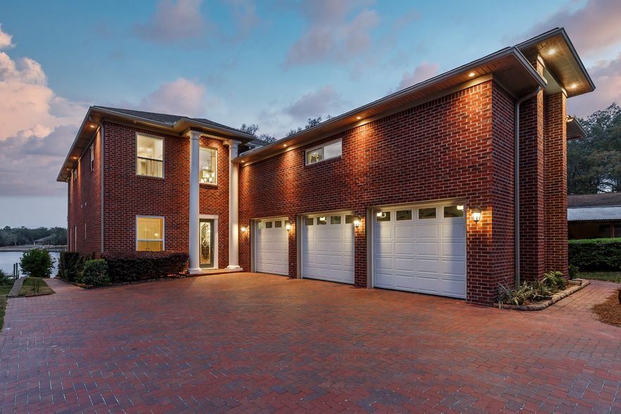 Under Contract with 72 hour kick-out clause, contingent on sale of buyer's property.  Immaculate waterfront home! THIS is comfortable luxury living. This gorgeous one-of-a-kind property includes an elevated lot on protected water with dock (recently re-decked with WearDeck!), boat house, slip/lift (20K lbs!), pilings recently wrapped for extra long life. Tons of outdoor features - manicured landscaping, 1st, 2nd floor porches with glorious water views. Meticulously cared for, feels brand new, with impressive attention to detail! Great floor plan with 3 en suites - 2 w/dble french doors leading to the rear porch. 2 laundry rooms (1st, 2nd floors), huge 2nd floor den. 1st floor office could be converted to a 4th bedroom with attached bath. Entire drive/parking/patio areas in brick pavers.