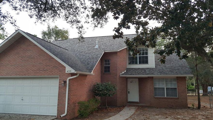 Beautiful 3 bedroom, 2.5 bath home situated on a corner lot in the heart of Niceville!
Your new home features beautiful low maintenance dark wood laminate flooring throughout the downstairs, tiled bathrooms, and carpeted bedrooms. The adorable kitchen features stainless steel appliances, white cabinetry, and a great little breakfast area. 
The living room offers great ambiance with a cozy fireplace, vaulted ceilings and an abundance of natural light. 1/2 bath located downstairs for convenience. 
The secluded primary bedroom is located downstairs and features a large en-suite bathroom with double vanity, tub/shower combo, and walk-in closet. 
Upstairs you'll find two additional bedrooms and a full bathroom. 
This home comes complete with a BRAND NEW A/C, 2-car attached garage and fenced backyard.
Conveniently located near top-rated schools, restaurants, shopping, and the beautiful white sand beaches in Destin.